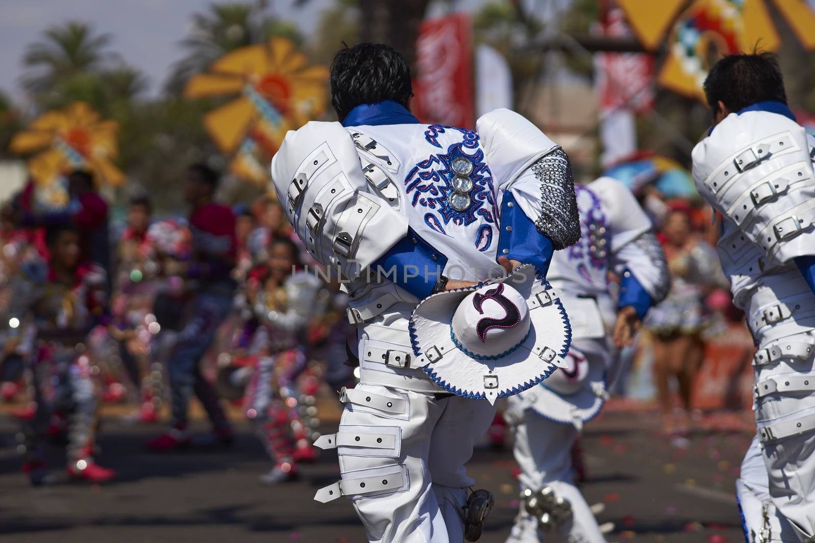 Caporales dancers in traditional Andean costume performing at the annual Carnaval Andino con la Fuerza del Sol in Arica, Chile.