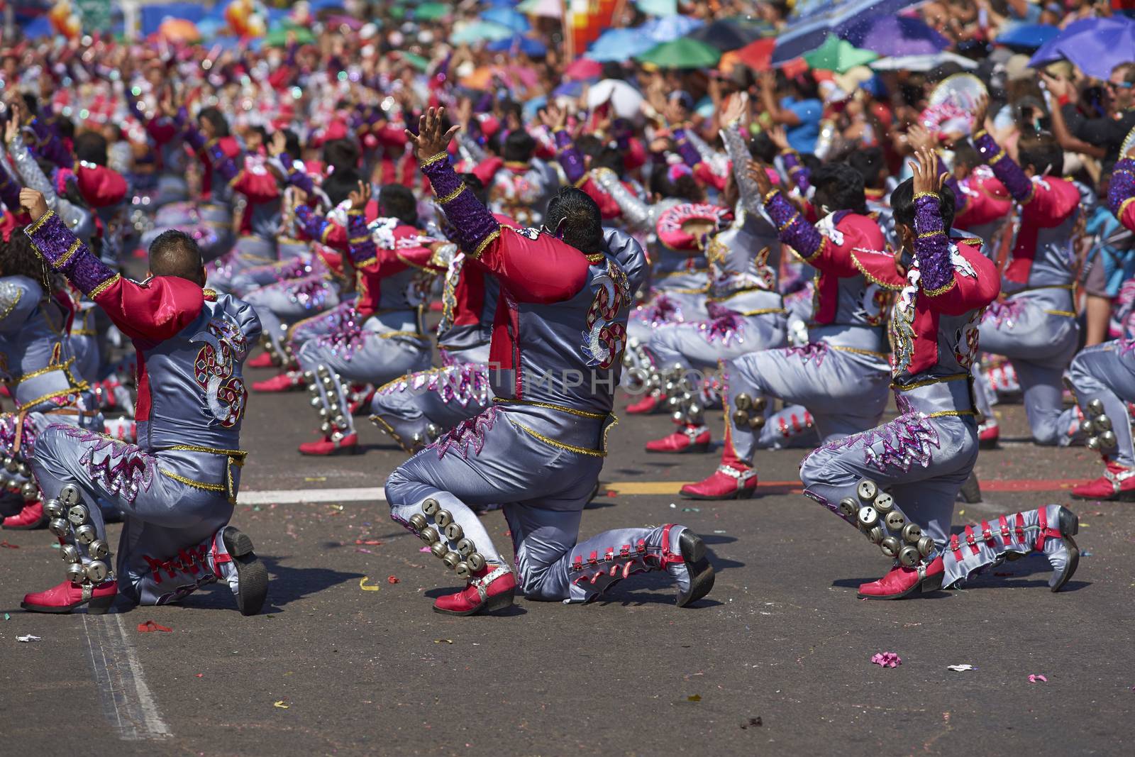 Caporales dancers in traditional Andean costume performing at the annual Carnaval Andino con la Fuerza del Sol in Arica, Chile.