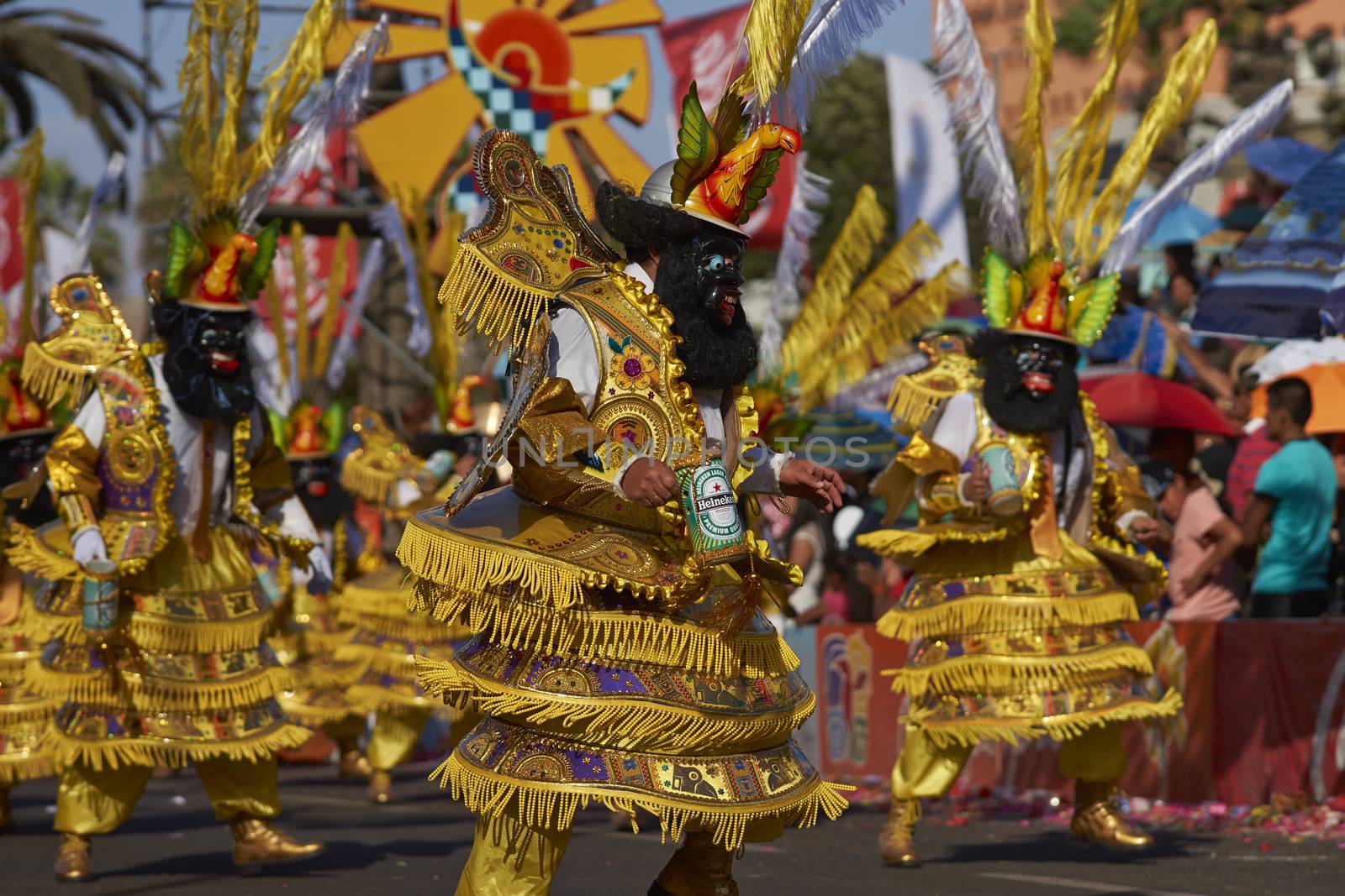 Morenada dancers in traditional Andean costume performing at the annual Carnaval Andino con la Fuerza del Sol in Arica, Chile.