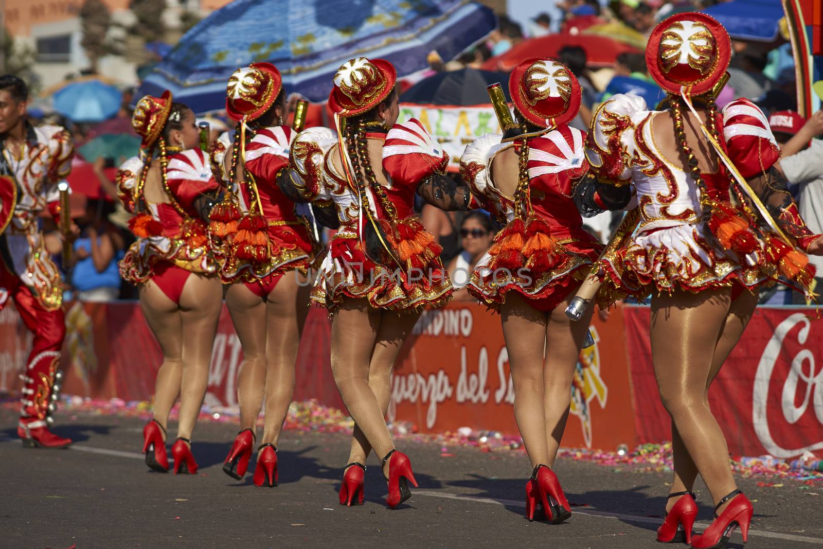 Caporales dancers in ornate costumes performing at the annual Carnaval Andino con la Fuerza del Sol in Arica, Chile.