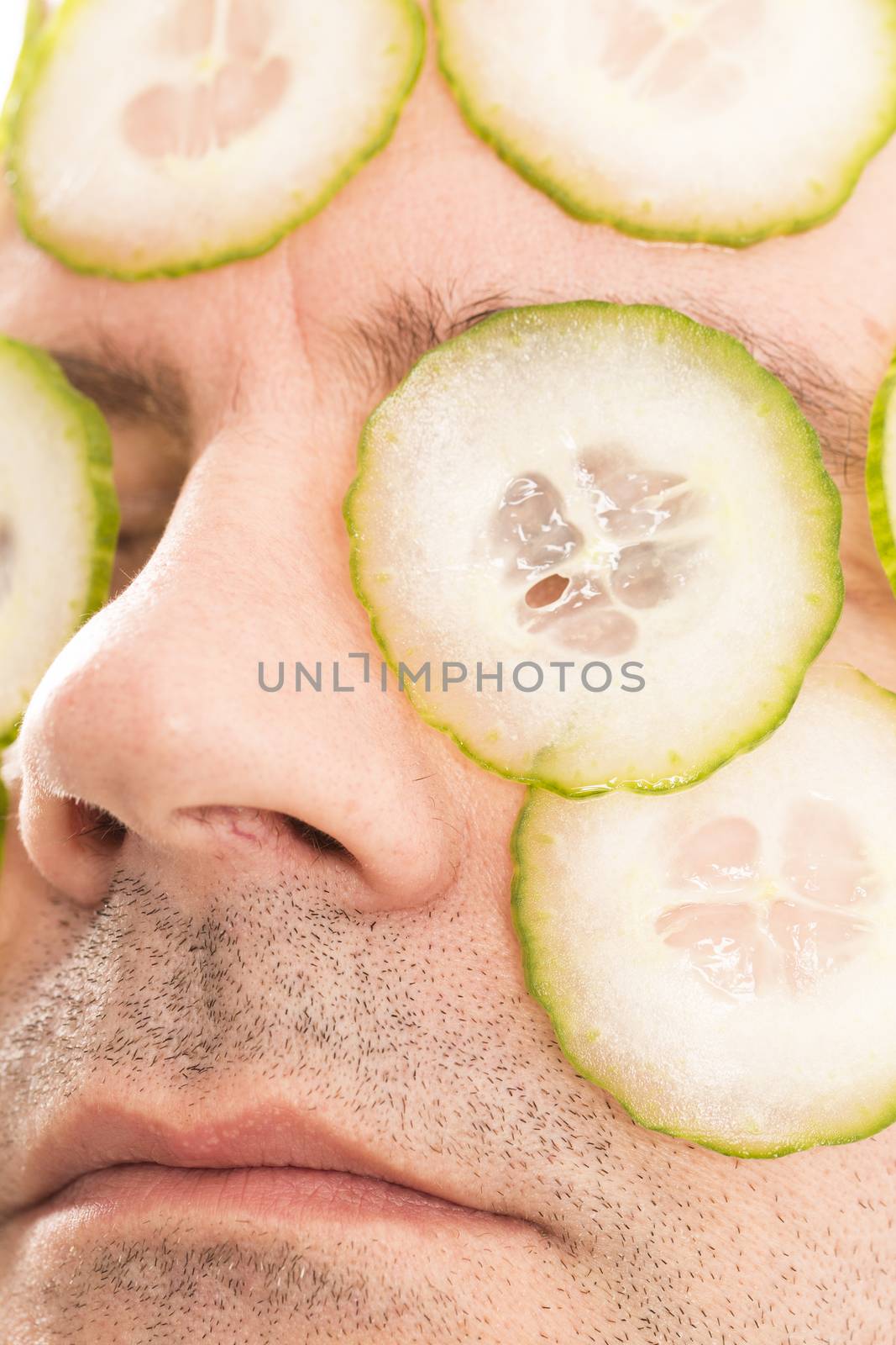 Close-up of mature man with face pack cucumber France