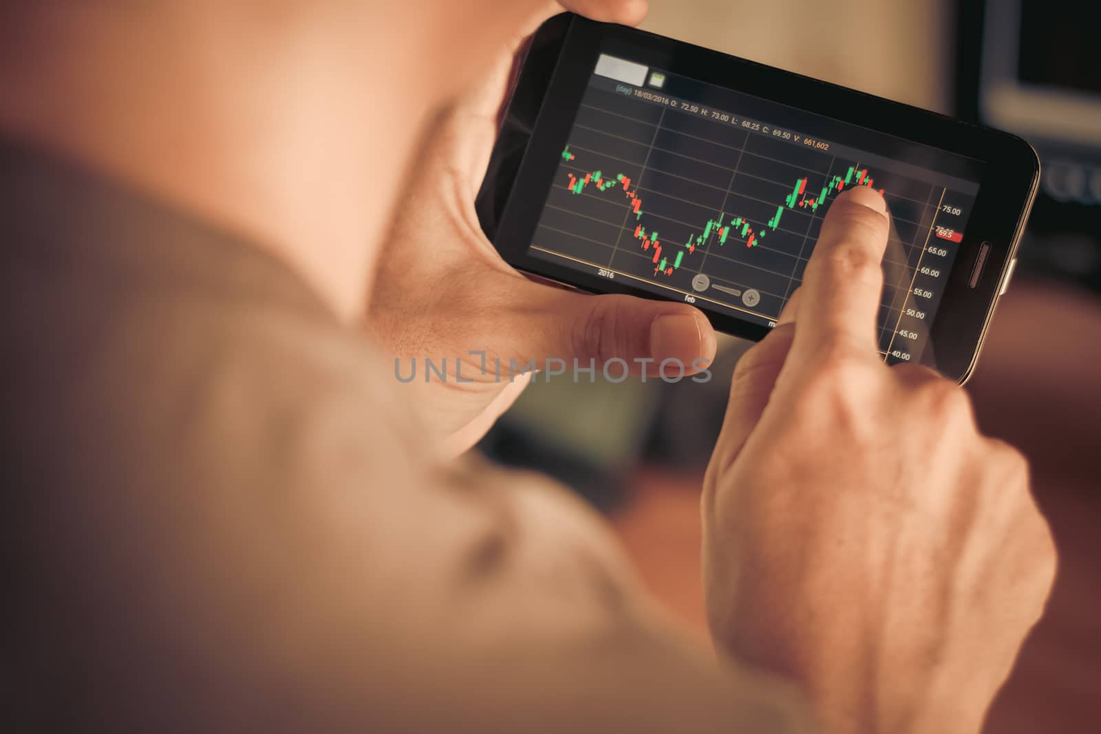 a man checking stock market on smartphone