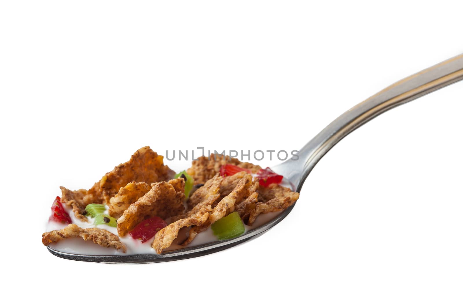 Spoon of cereal with milk, strawberries and kiwi