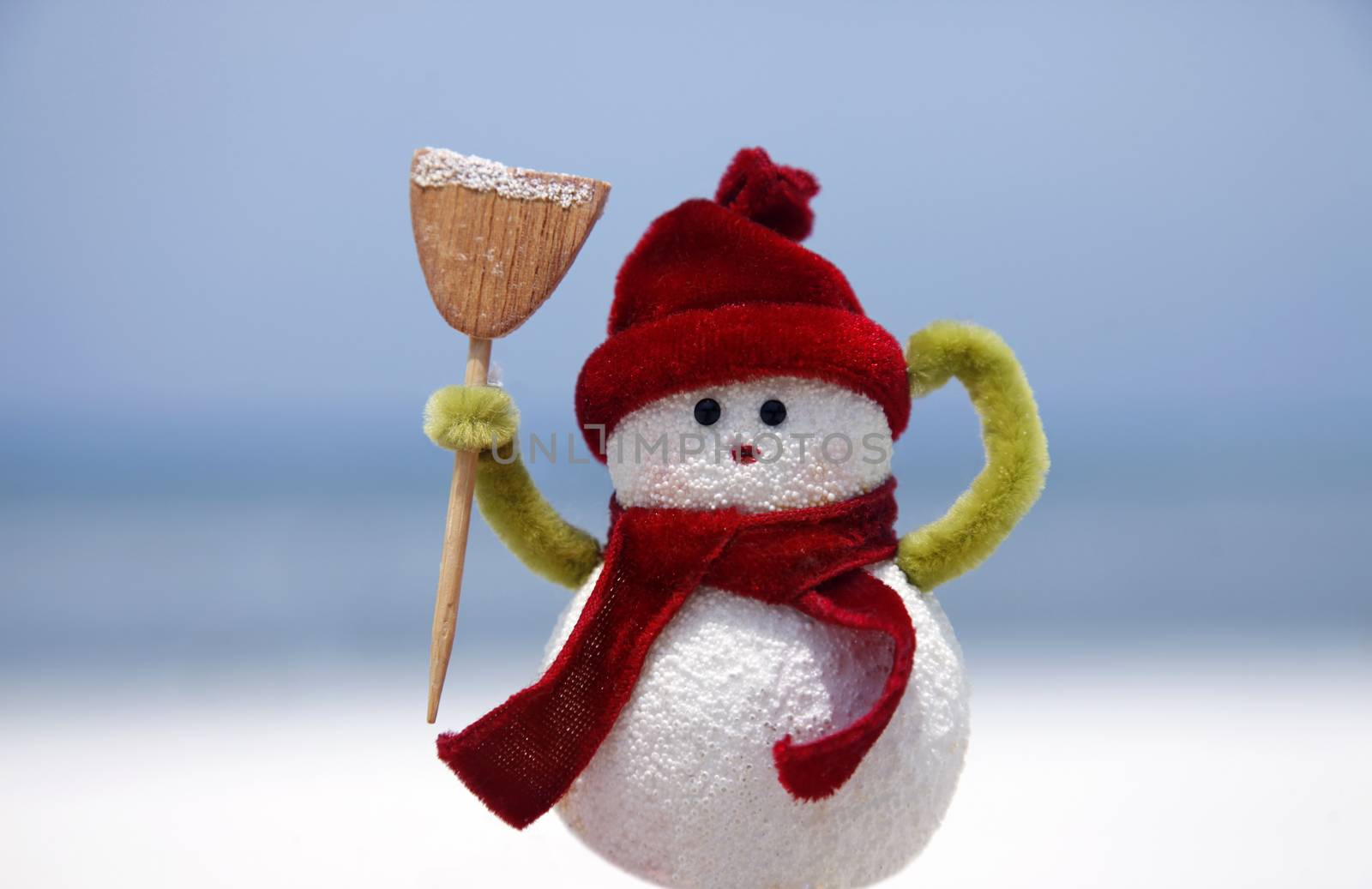 Toy of the snowman on blue background