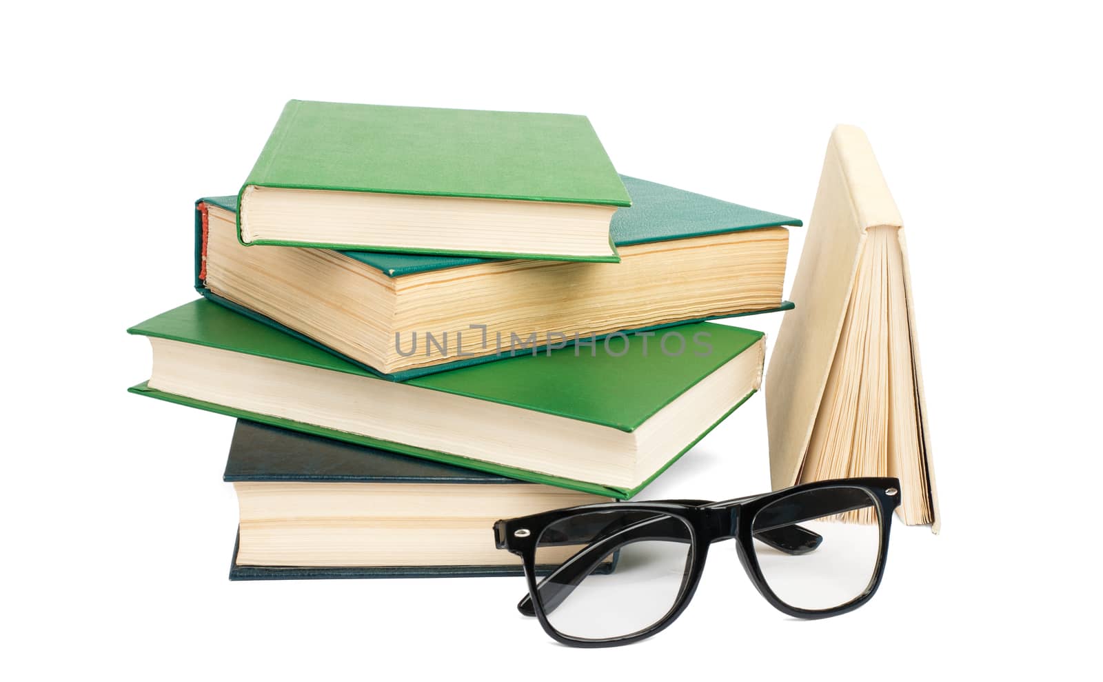 Pile of books with glasses isolated on white background, closeup