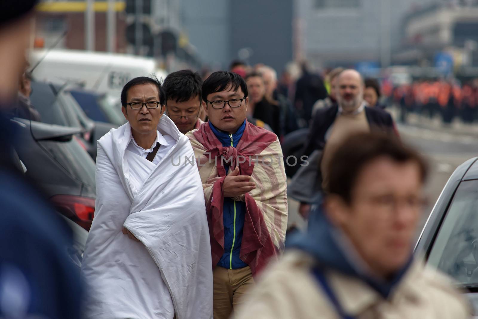 BELGIUM, Brussels: Passengers leave Brussels airport, on March 22, 2016 in Zaventem , following its evacuation after at least 13 people were killed and 35 injured as twin blasts rocked the main terminal of Brussels airport.
