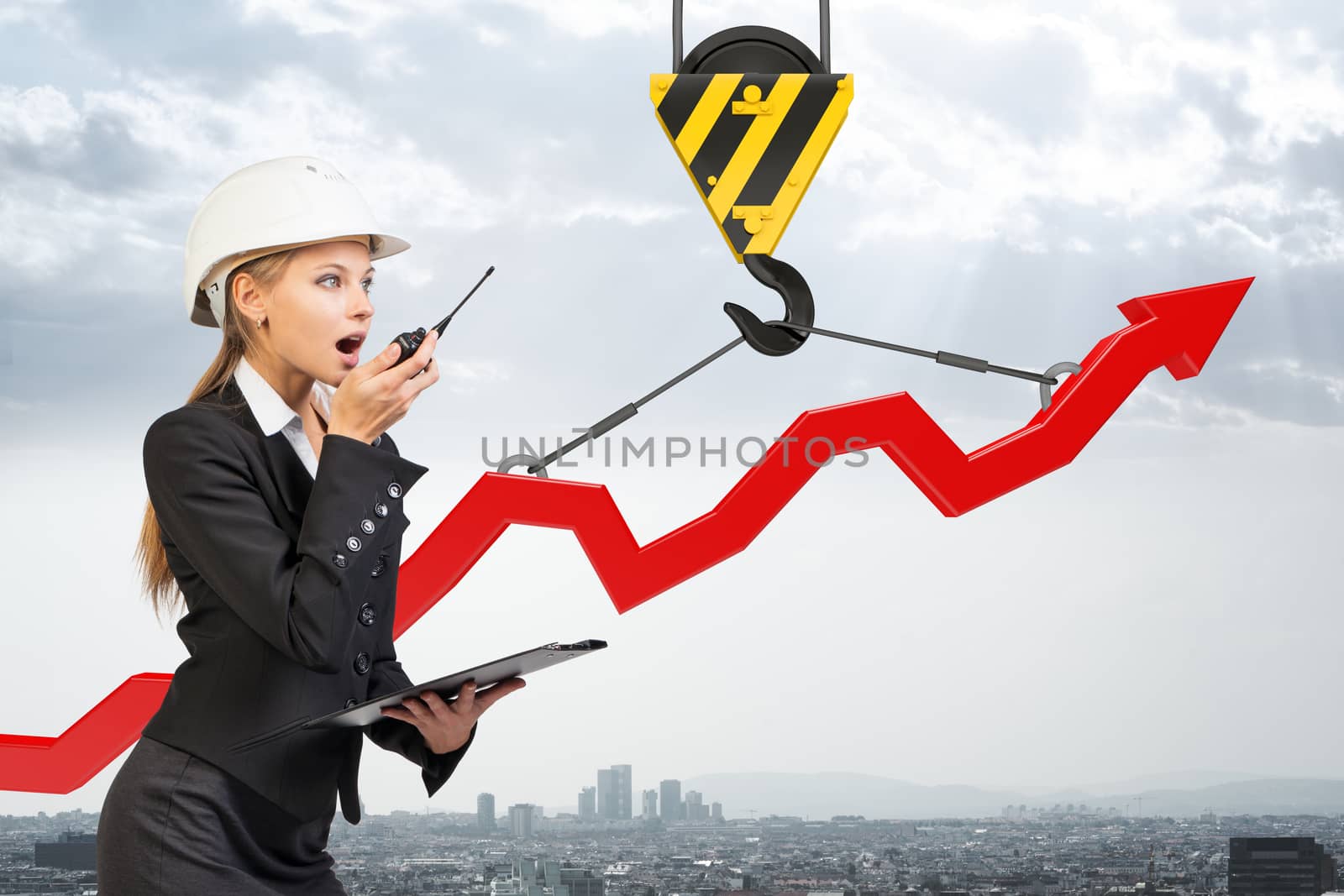 Businesslady with walkie-talkie set and graphical chart