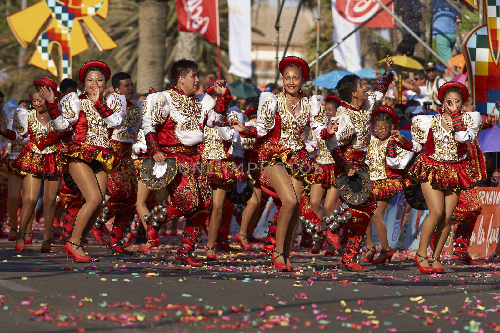Caporales dancers in ornate costumes performing at the annual Carnaval Andino con la Fuerza del Sol in Arica, Chile.