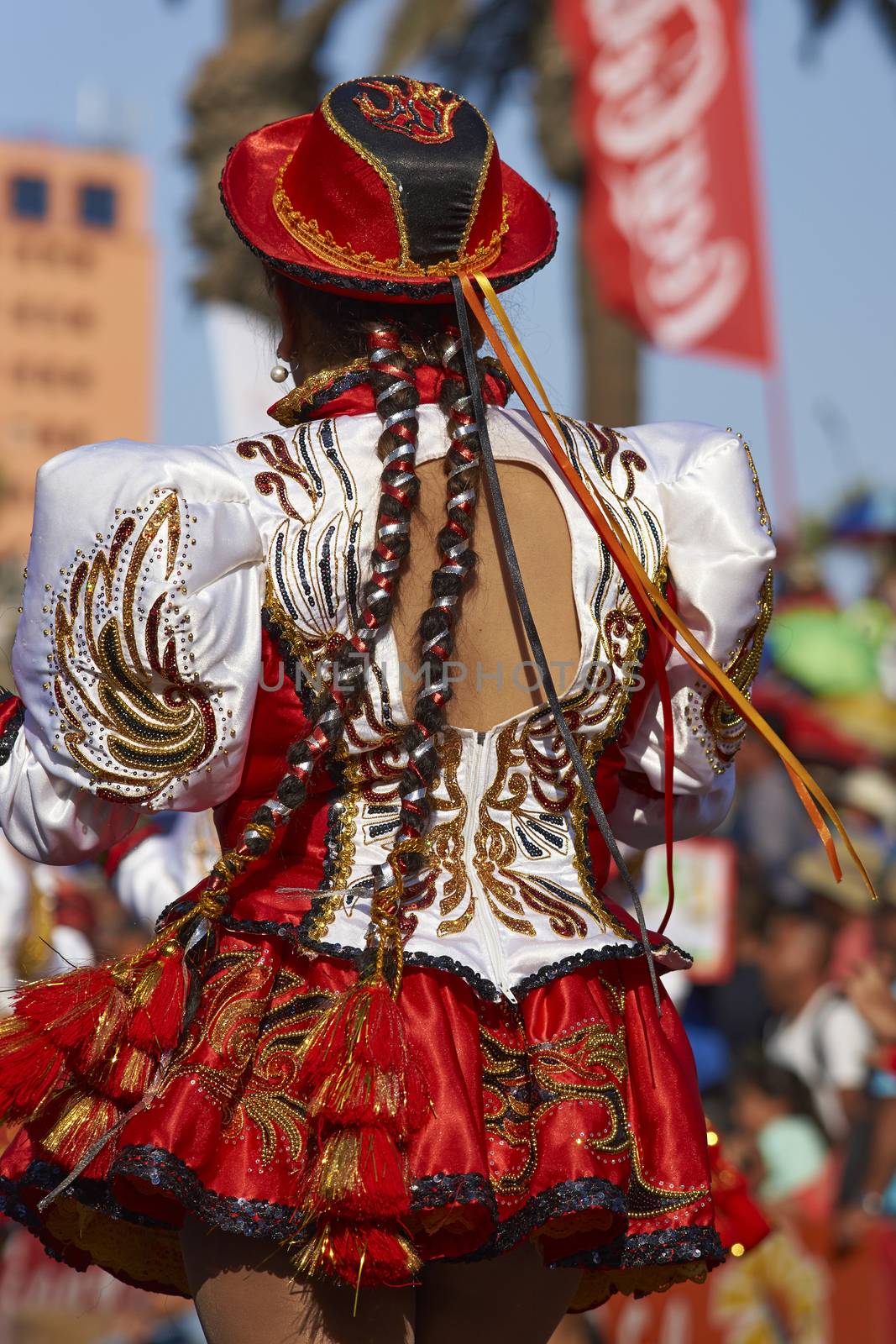 Caporales dancers in ornate costumes performing at the annual Carnaval Andino con la Fuerza del Sol in Arica, Chile.