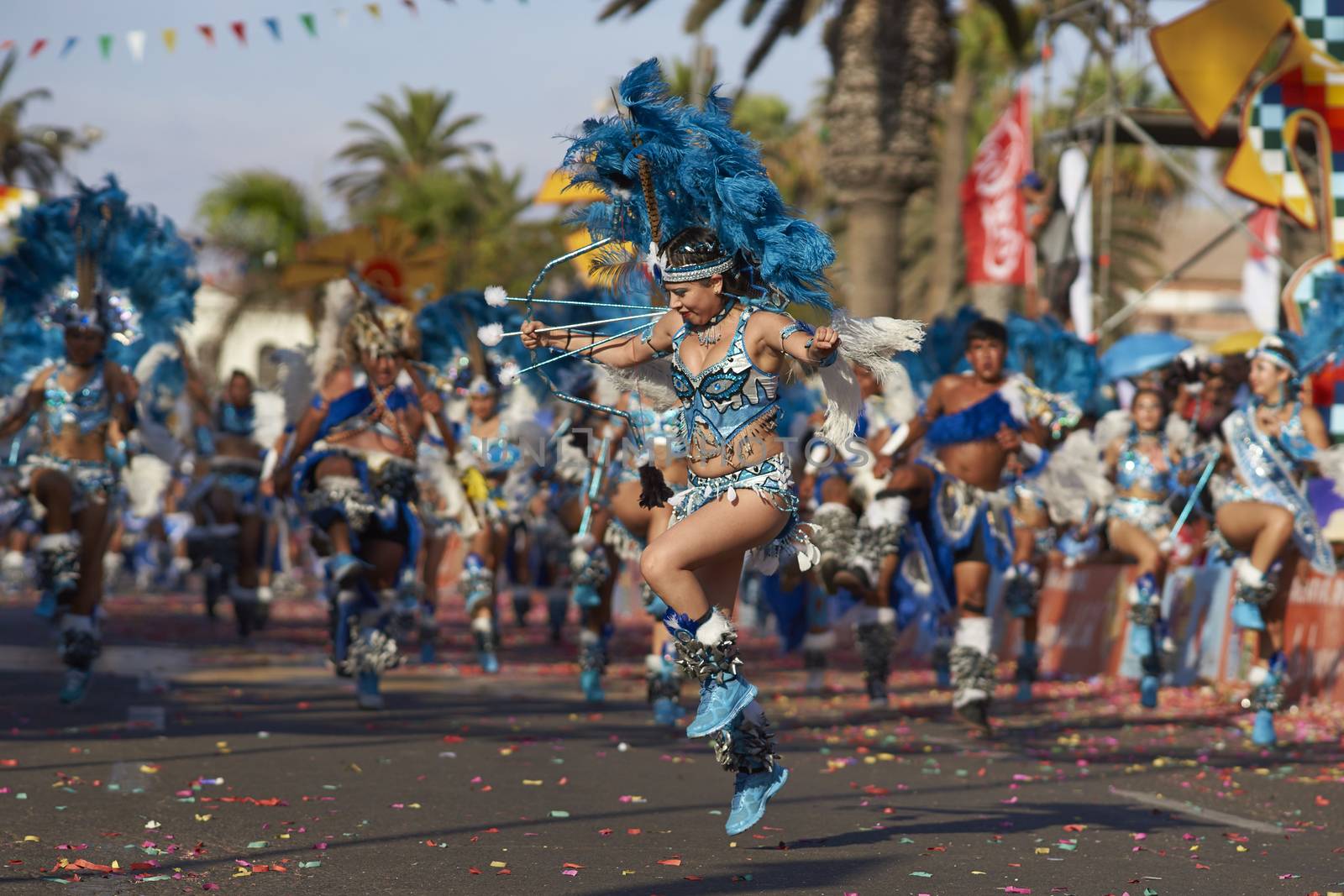 Tobas dancers in traditional Andean costumes performing at the annual Carnaval Andino con la Fuerza del Sol in Arica, Chile.
