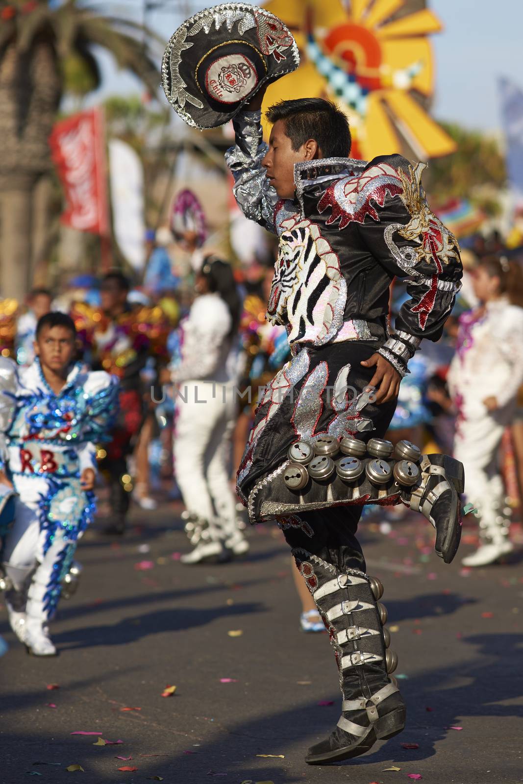 Caporales dancers in traditional Andean costume performing at the annual Carnaval Andino con la Fuerza del Sol in Arica, Chile.