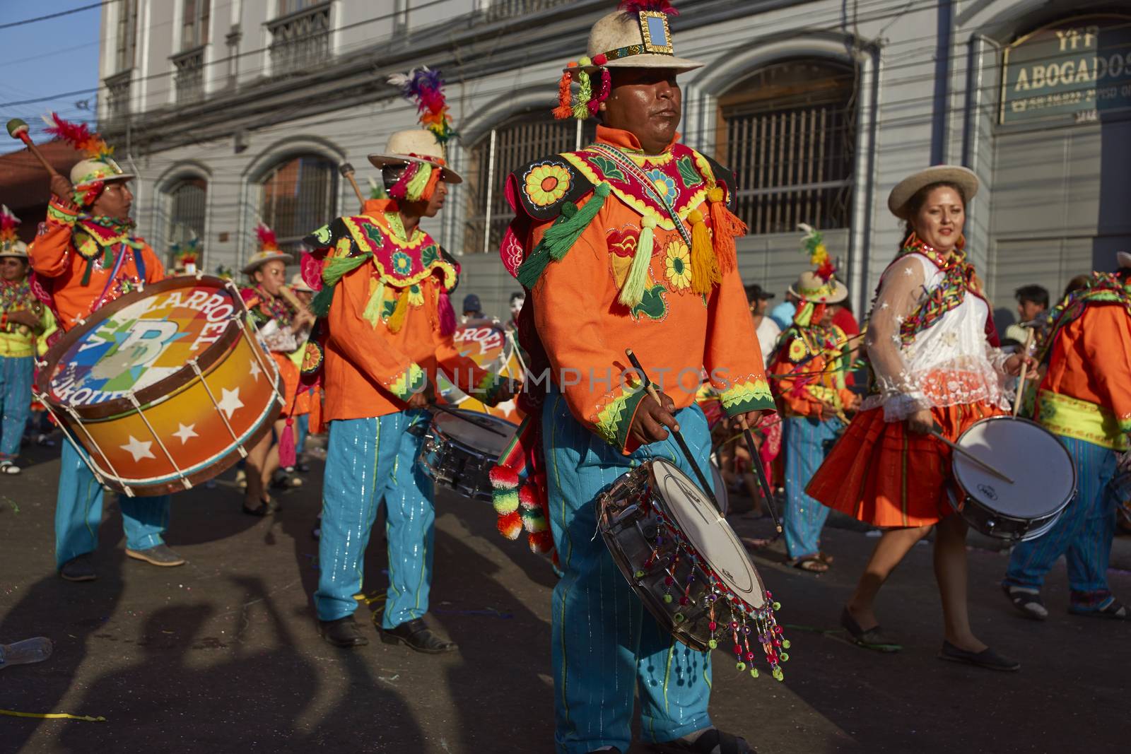 Music and dance group in traditional Andean costume performing at the annual Carnaval Andino con la Fuerza del Sol in Arica, Chile.