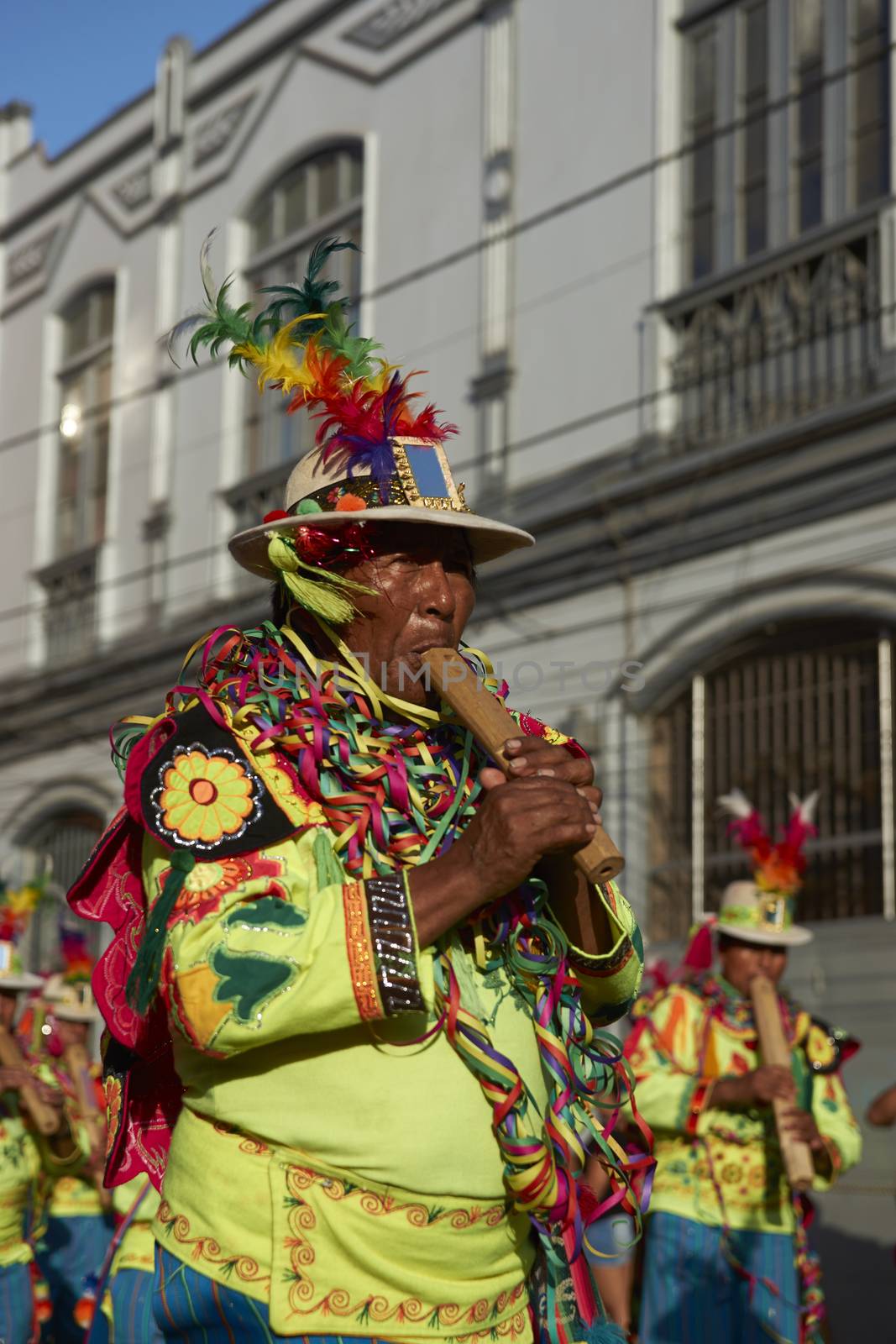 Band in traditional Andean costume performing at the annual Carnaval Andino con la Fuerza del Sol in Arica, Chile.