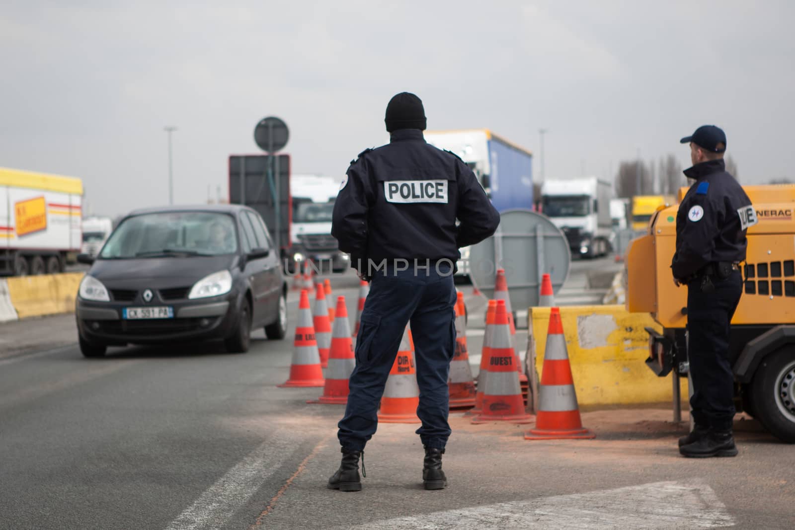FRANCE, Neuville-en-Ferrain: French police officers check vehicles at the French-Belgian border, near Neuville-en-Ferrain, northern France, on March 22, 2016 , as security measures have been reinforced after a series of apparently coordinated explosions ripped through Brussels airport and a metro train on Tuesday, killing at least 26 people in the latest attacks to target Europe.