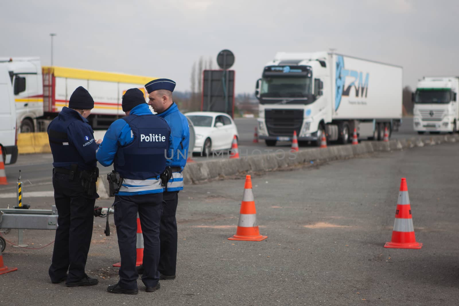 FRANCE, Neuville-en-Ferrain: Belgian police officers check vehicles at the French-Belgian border, near Neuville-en-Ferrain, northern France, on March 22, 2016 , as security measures have been reinforced after a series of apparently coordinated explosions ripped through Brussels airport and a metro train on Tuesday, killing at least 26 people in the latest attacks to target Europe.