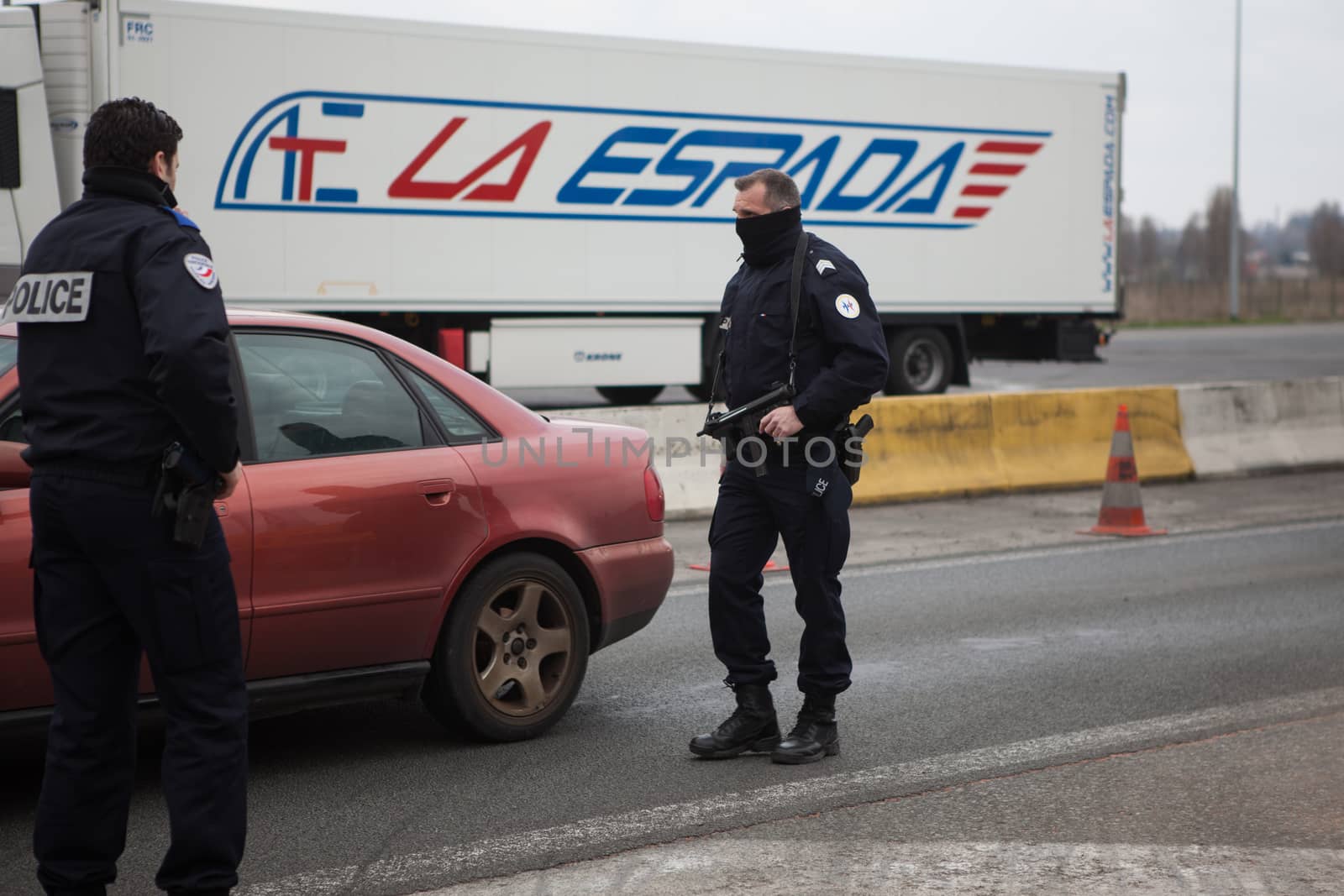 FRANCE, Neuville-en-Ferrain: French police officers check vehicles at the French-Belgian border, near Neuville-en-Ferrain, northern France, on March 22, 2016 , as security measures have been reinforced after a series of apparently coordinated explosions ripped through Brussels airport and a metro train on Tuesday, killing at least 26 people in the latest attacks to target Europe.