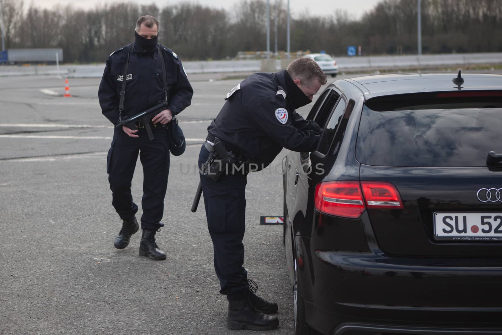 FRANCE, Neuville-en-Ferrain: French police officers check vehicles at the French-Belgian border, near Neuville-en-Ferrain, northern France, on March 22, 2016 , as security measures have been reinforced after a series of apparently coordinated explosions ripped through Brussels airport and a metro train on Tuesday, killing at least 26 people in the latest attacks to target Europe.