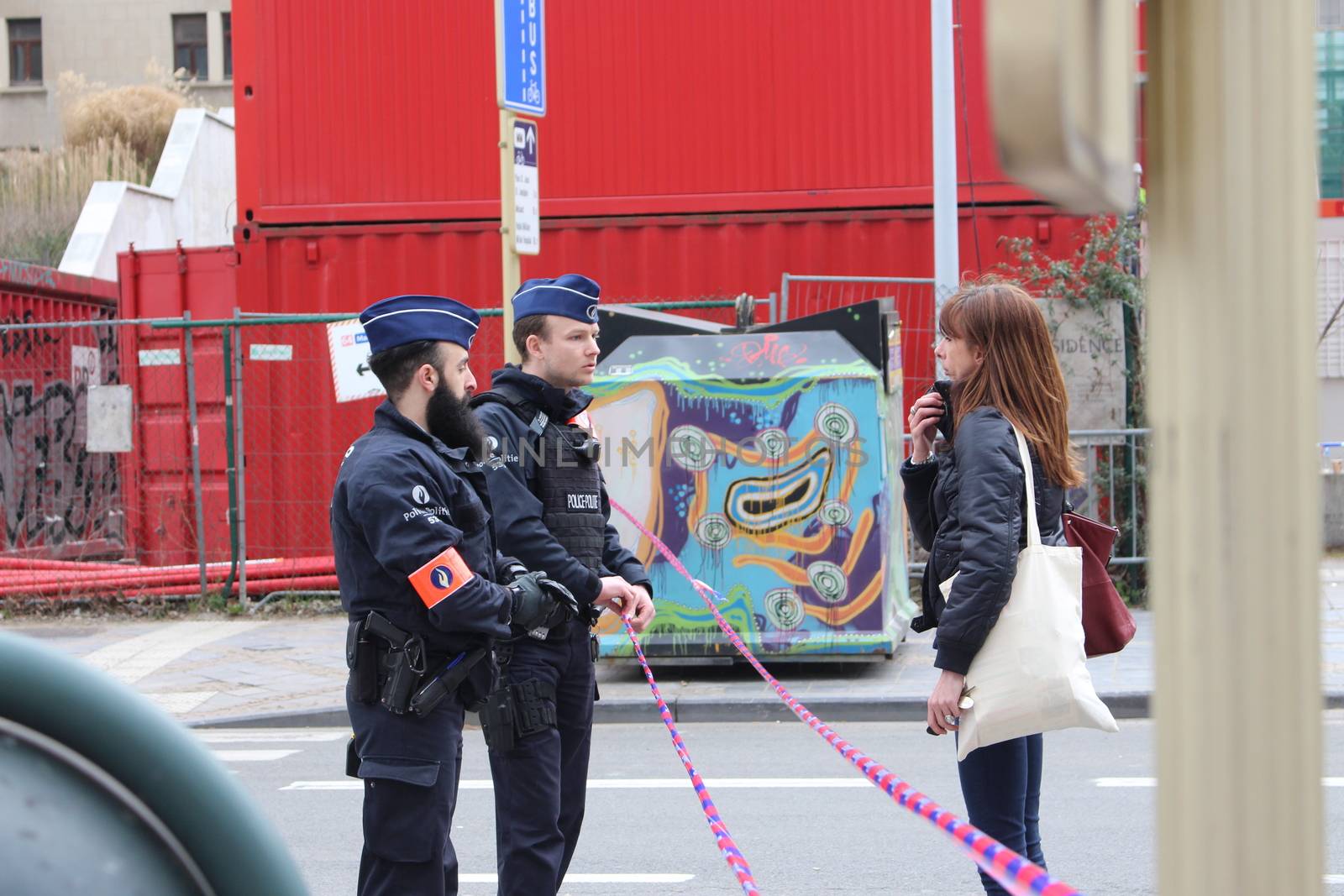 BELGIUM, Brussels: Several streets are closed off in Brussels, Belgium as police speak to a civilian near Maelbeek metro station, following the deadly attacks both here and at Zaventem airport on March 22, 2016. The attacks, at least one of which was carried out by a suicide bomber, left at least 30 dead, and scores more injured.