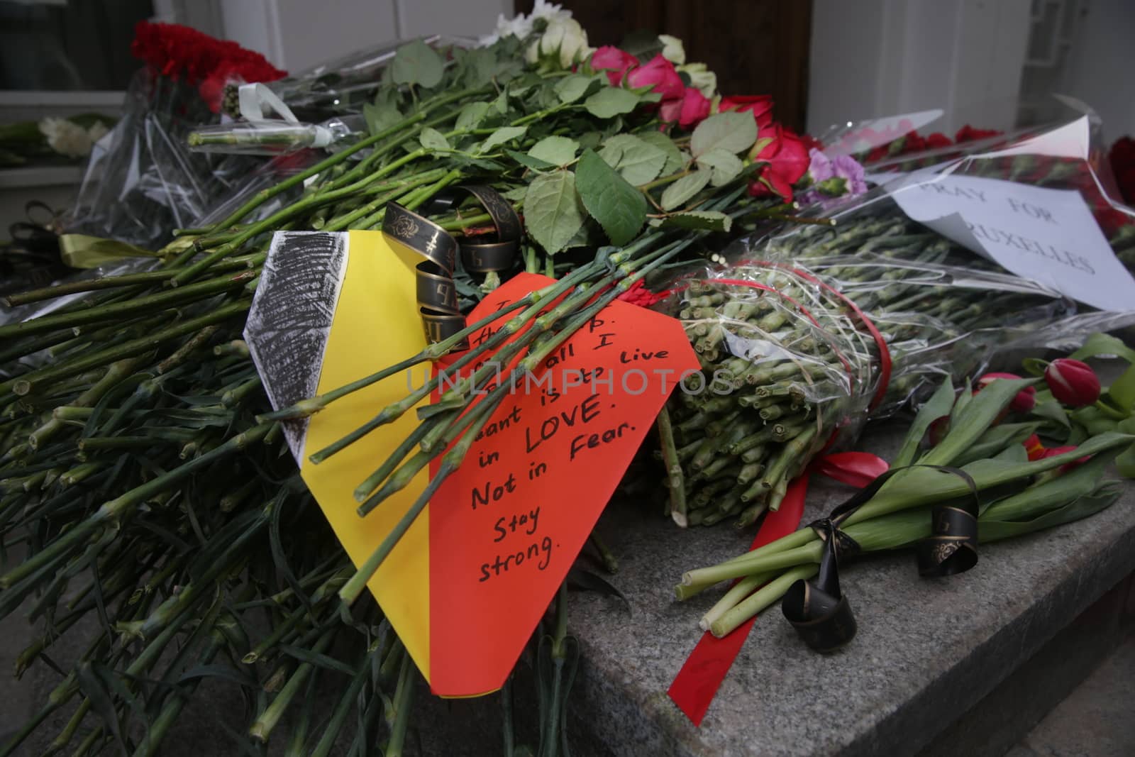 RUSSIA, Moscow: A makeshift memorial has taken shape at the Belgian Embassy in Moscow, Russia following the terror attacks that left at least 30 dead and hundreds injured in Brussels, Belgium on March 22, 2016. The Islamic State terror group has taken responsibility for the attacks, which brought death and destruction on Zaventem airport and Maelbeek metro station.