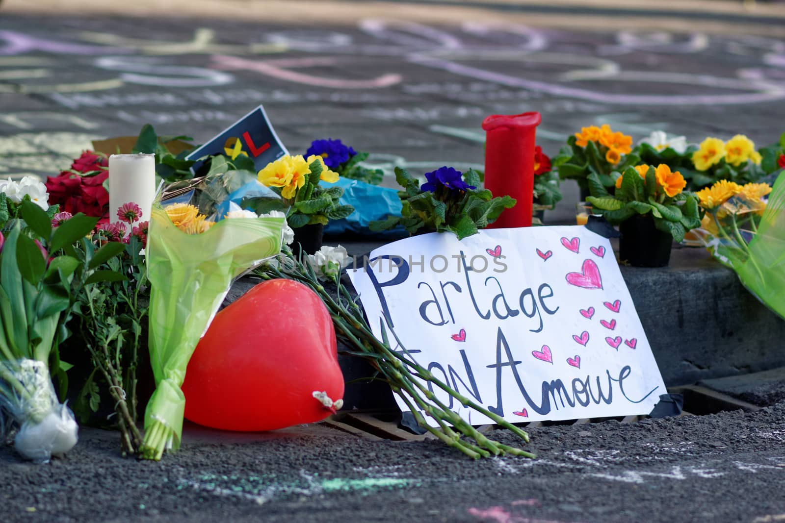 BELGIUM, Brussels: A note reading 'Share your love' is seen as hundreds pay tribute to the victims of the attacks that hit the Belgian capital on March 22, 2016.