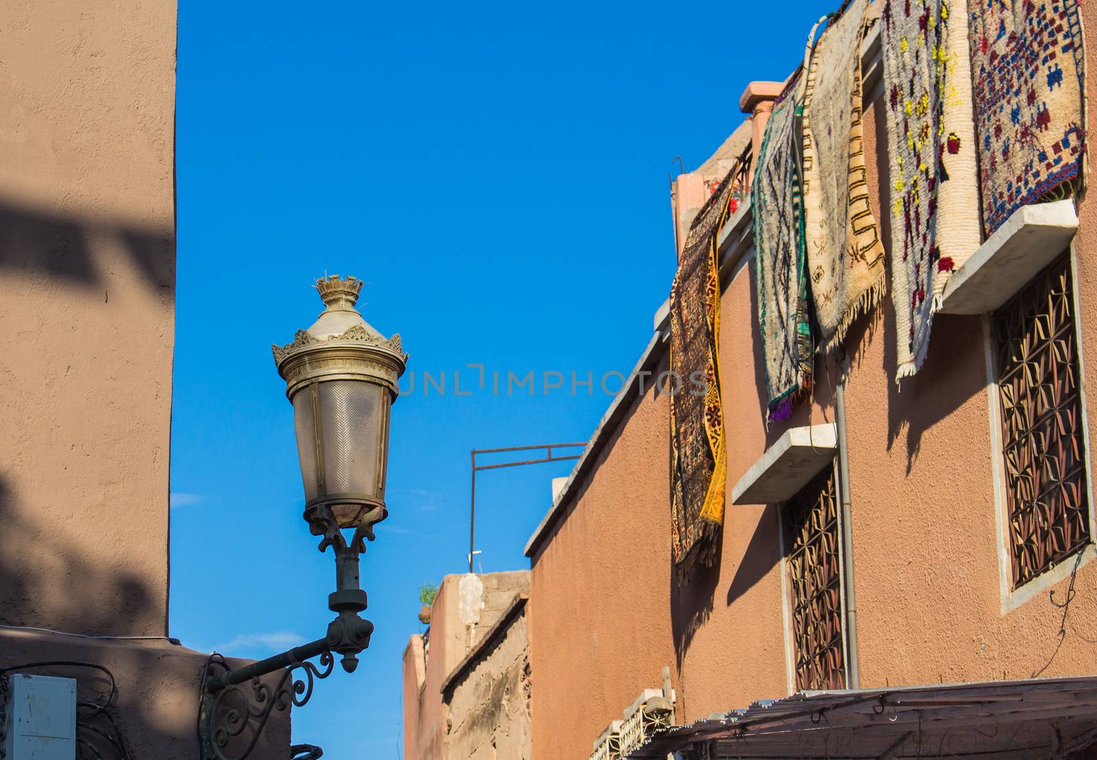 Street with a lantern in Marrakesh, Morocco by YassminPhoto