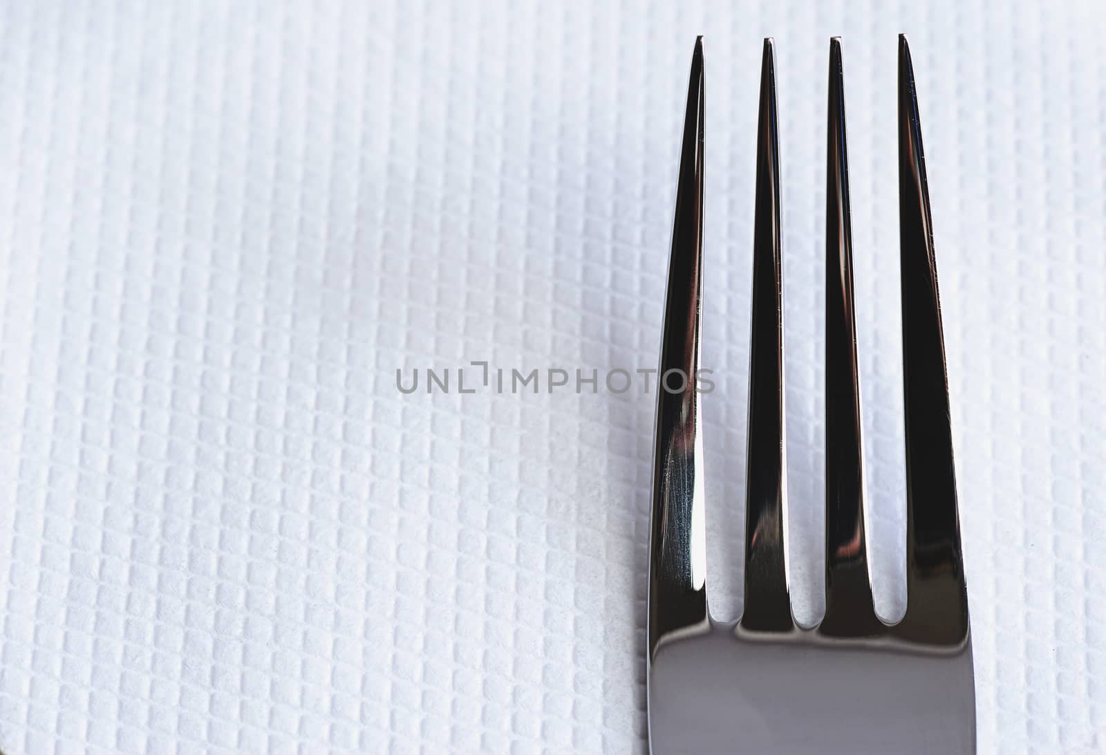 Fork close up on white napkin