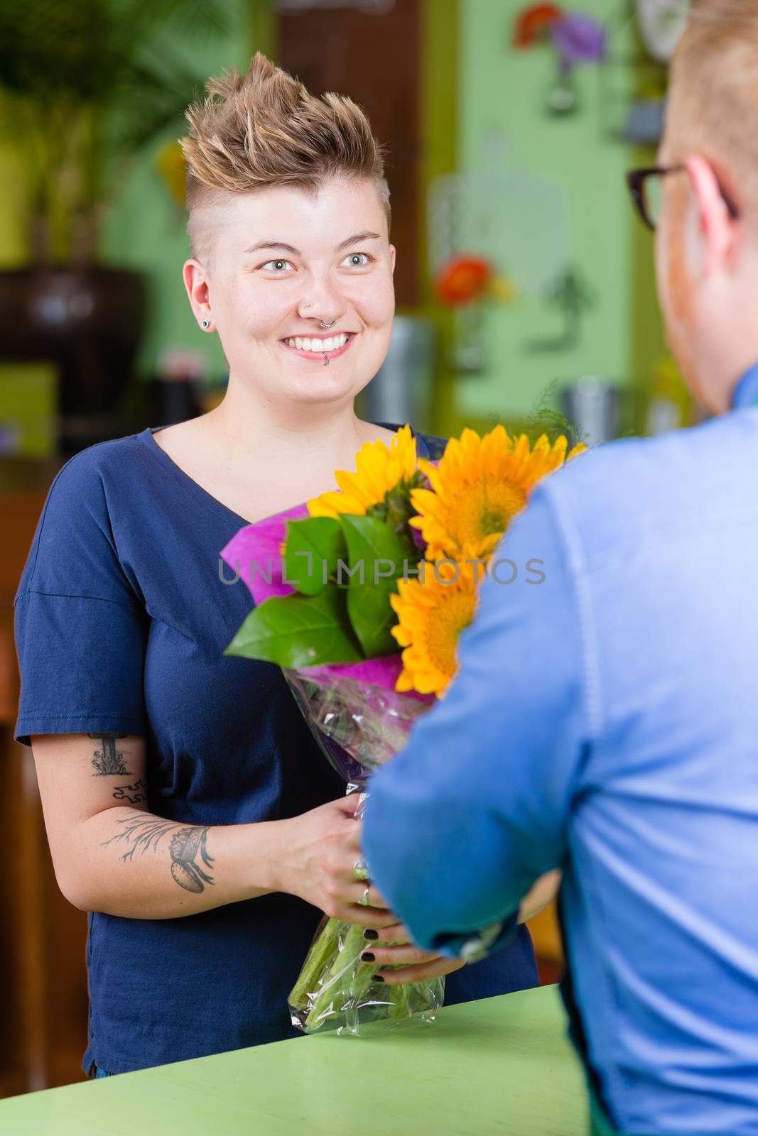 Cute Woman in Flower Shop Purchases Sunflowers by Creatista