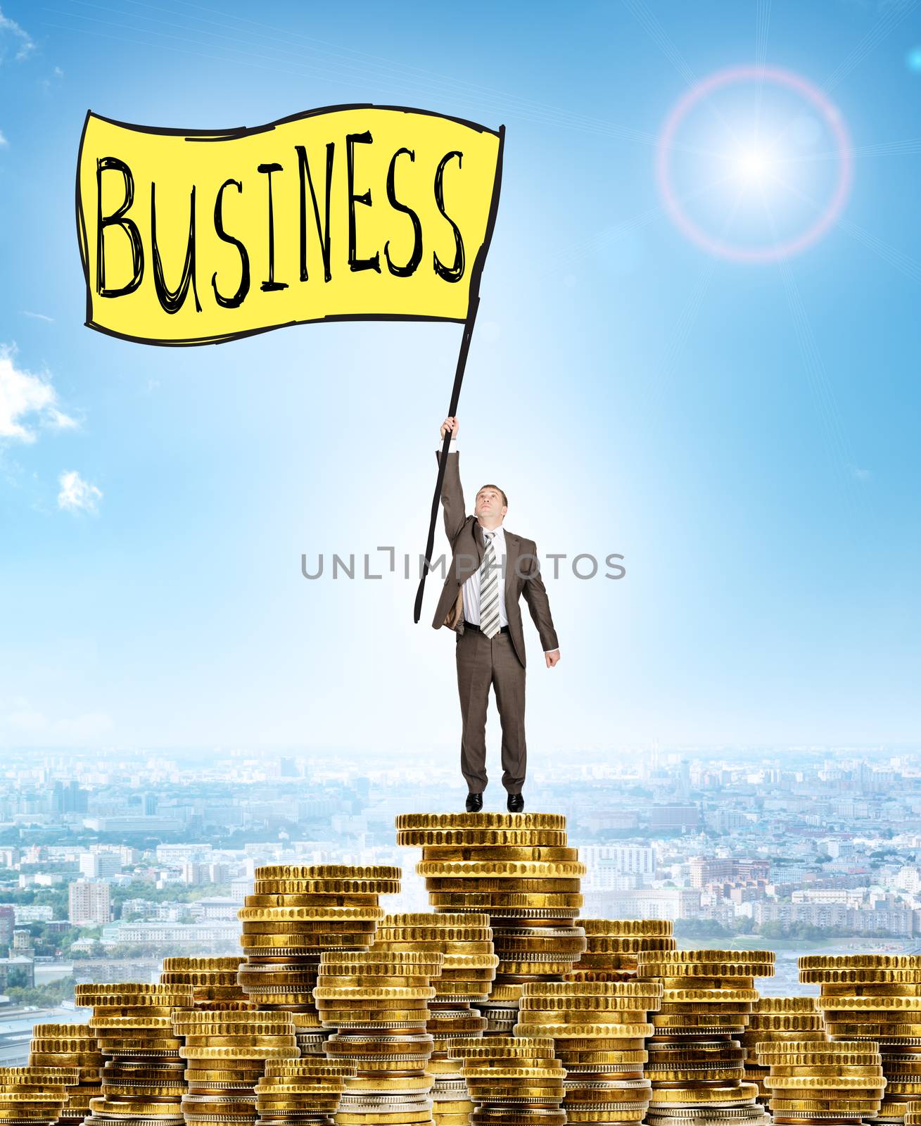 Businessman holding flag with word business and standing on coins