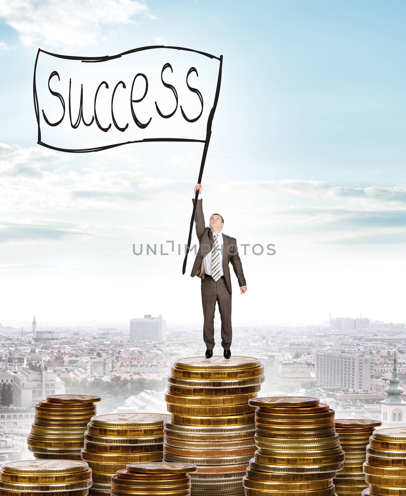 Businessman holding flag with word success and standing on coins