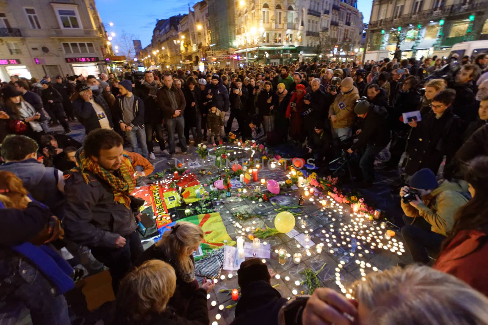 BELGIUM, Brussels: Thousands gather around a makeshift memorial to pay tribute and mourn the victims of the bomb attacks, at the Place de la Bourse, in Brussels, Belgium, March 22, 2016.