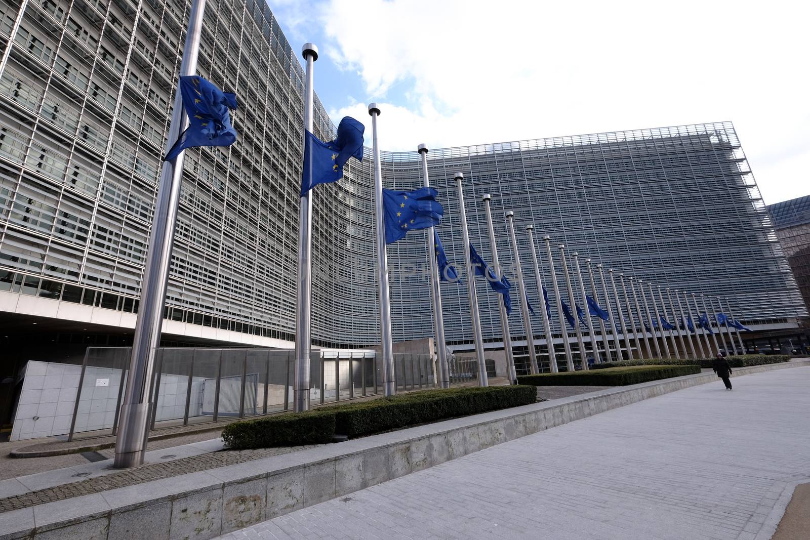 BELGIUM, Brussels: European Union flags fly at half-mast in front of  the EU Commission Headquarters in respect and remembrance of the victims of the terror attack that hit Brussels on March 22, 2016. At least 30 people are thought to have been killed after Zaventem airport and Maelbeek Metro station were targeted by explosions.