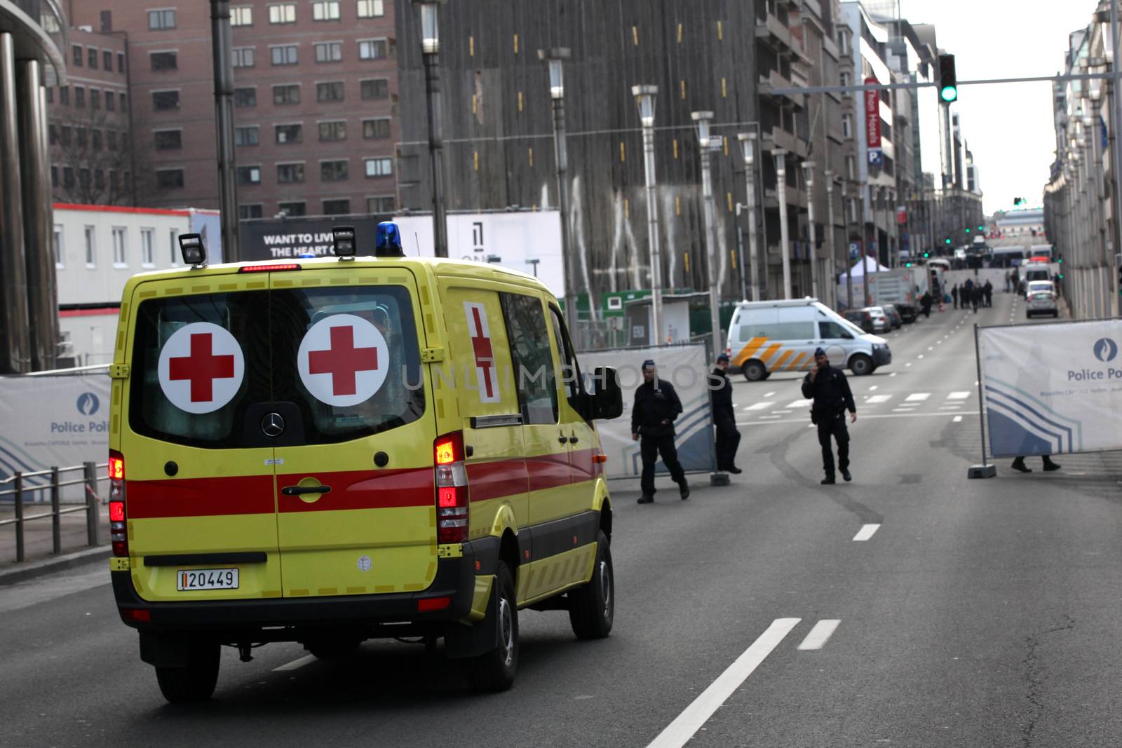 BELGIUM, Brussels: An ambulance arrives at the area of the explosion at the Maelbeek - Maalbeek subway station in Brussels, on March 22, 2016. In the morning two bombs exploded at the departure hall of Brussels Airport and another one at the Maelbeek - Maalbeek subway station, which killed around 30 people.