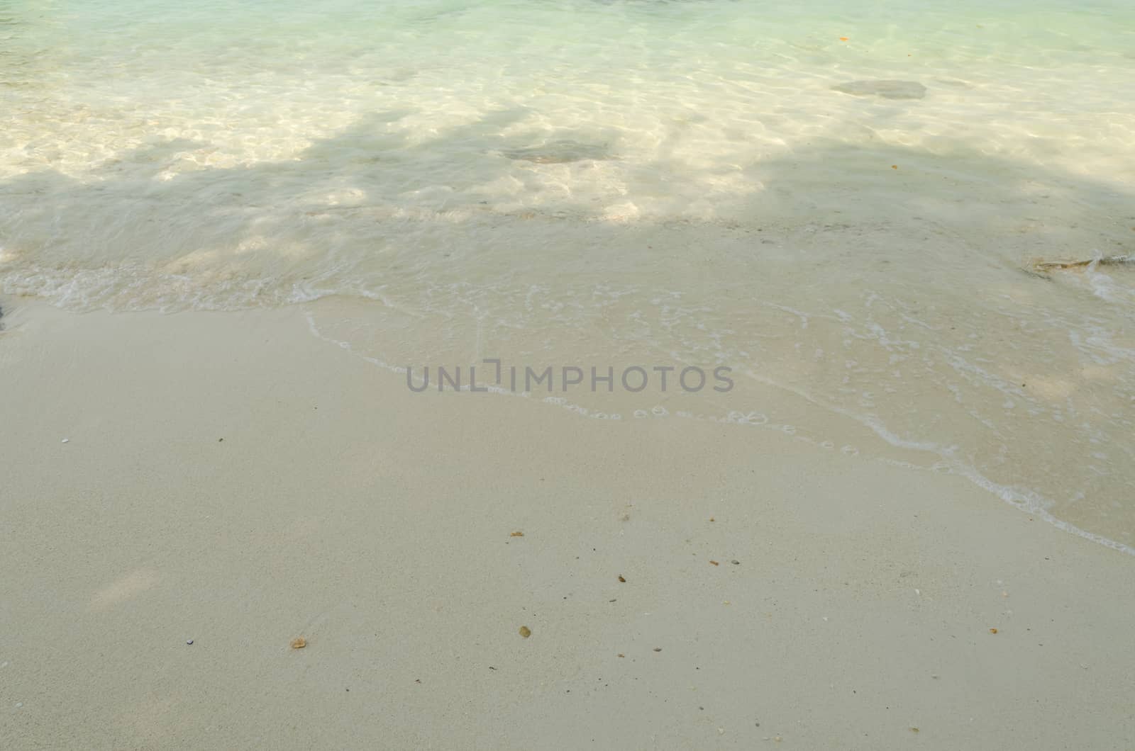 Beautiful sea summer or spring abstract background. Golden sand beach with blue ocean.