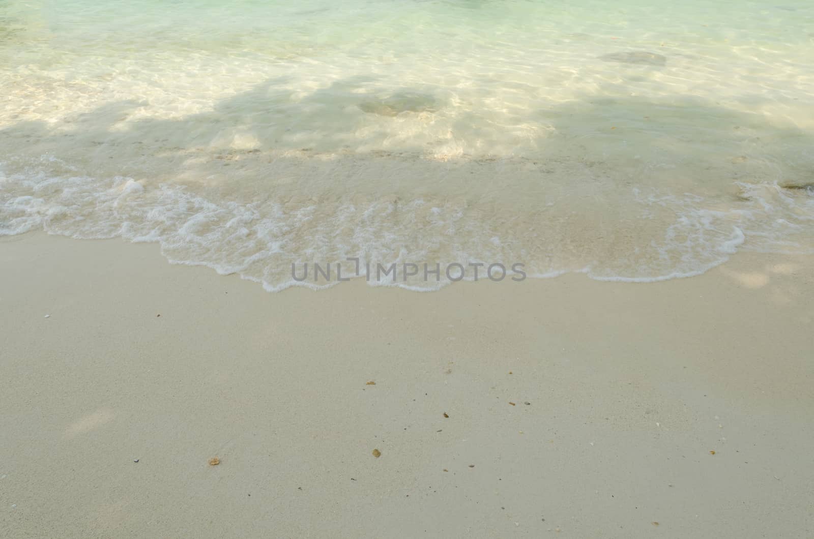 Beautiful sea summer or spring abstract background. Golden sand beach with blue ocean.