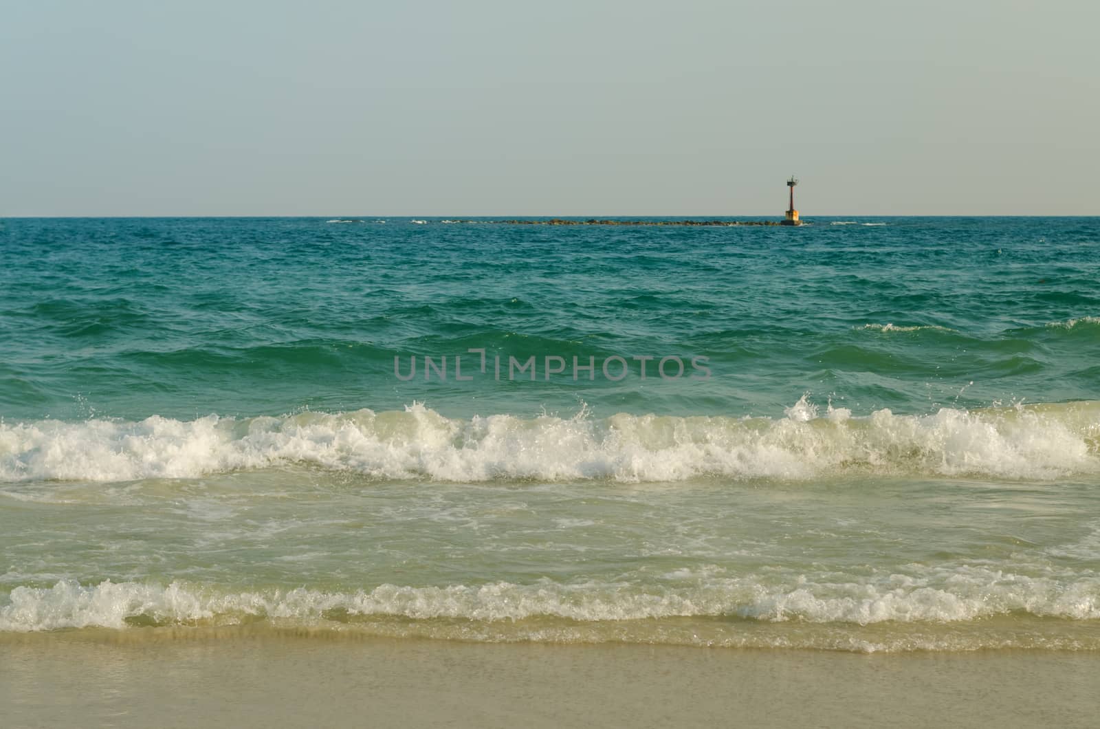 Beautiful sea summer or spring abstract background. Golden sand beach with blue ocean.