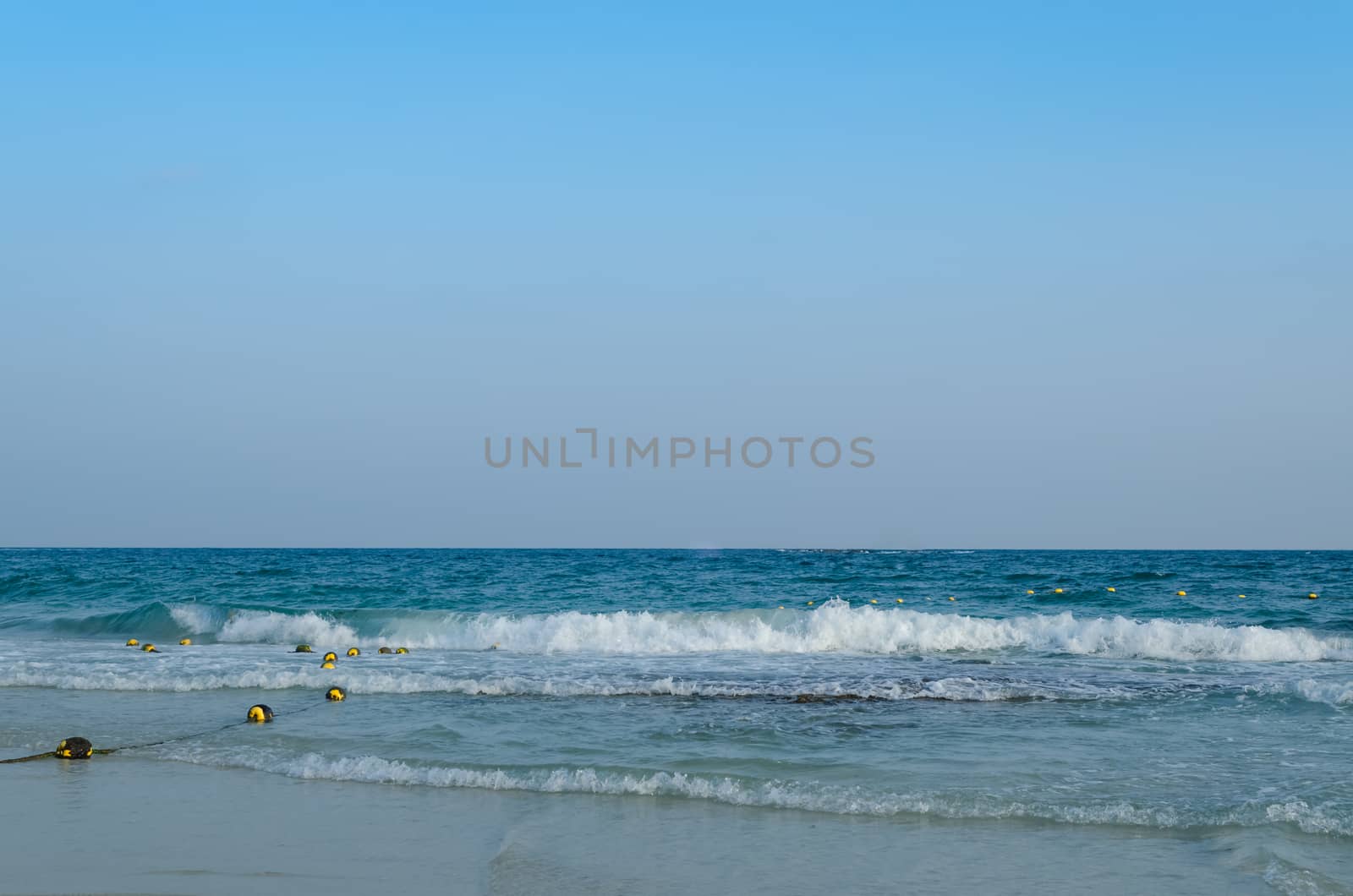 Beautiful sea summer or spring abstract background. Golden sand beach with blue ocean.