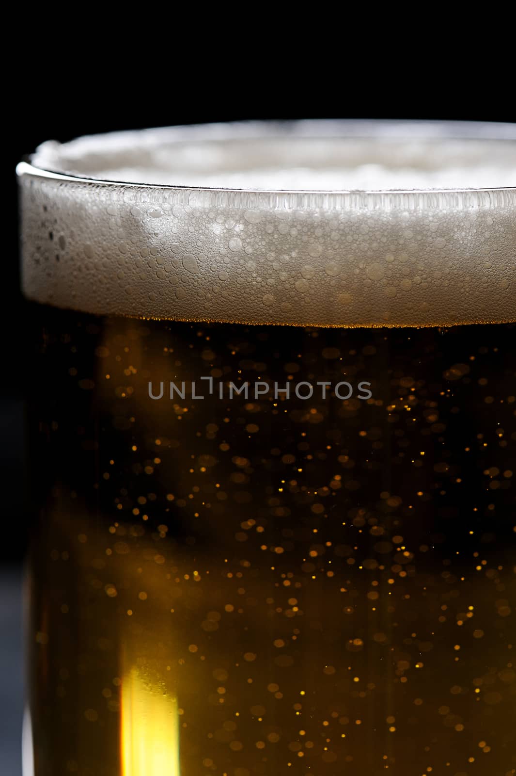 close up beer glass with foam on top