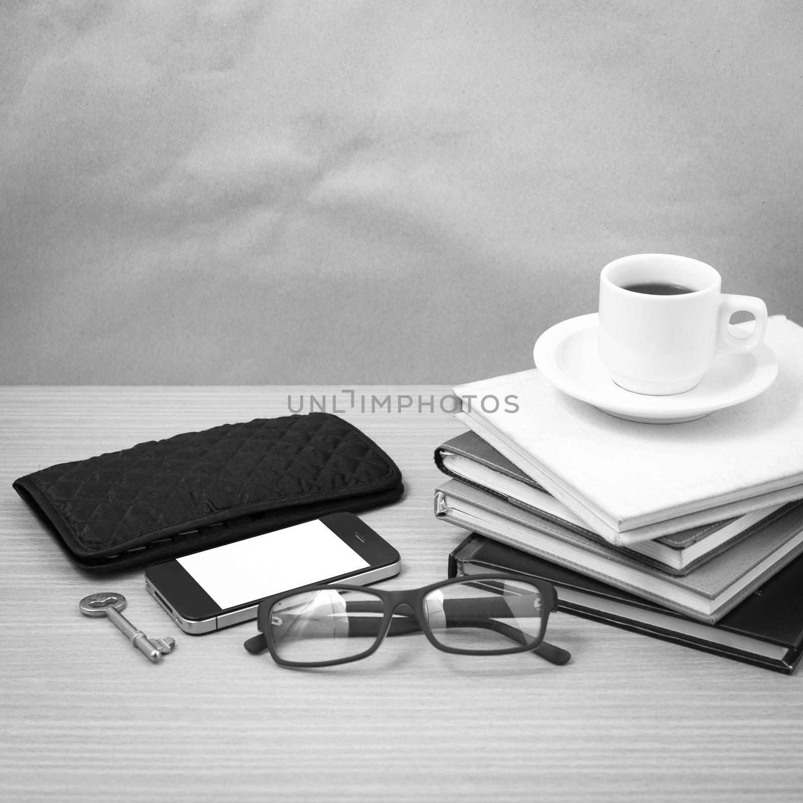 coffee and phone with stack of book,key,eyeglasses and wallet bl by ammza12