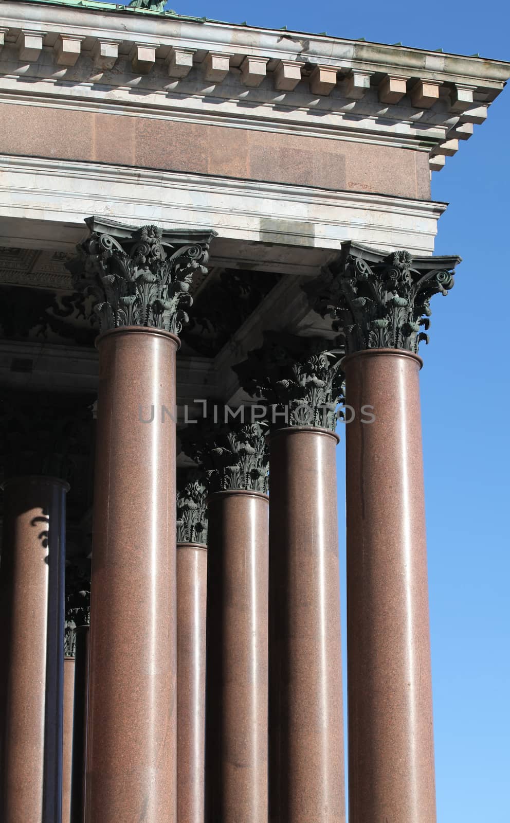 columns with portico on background blue sky