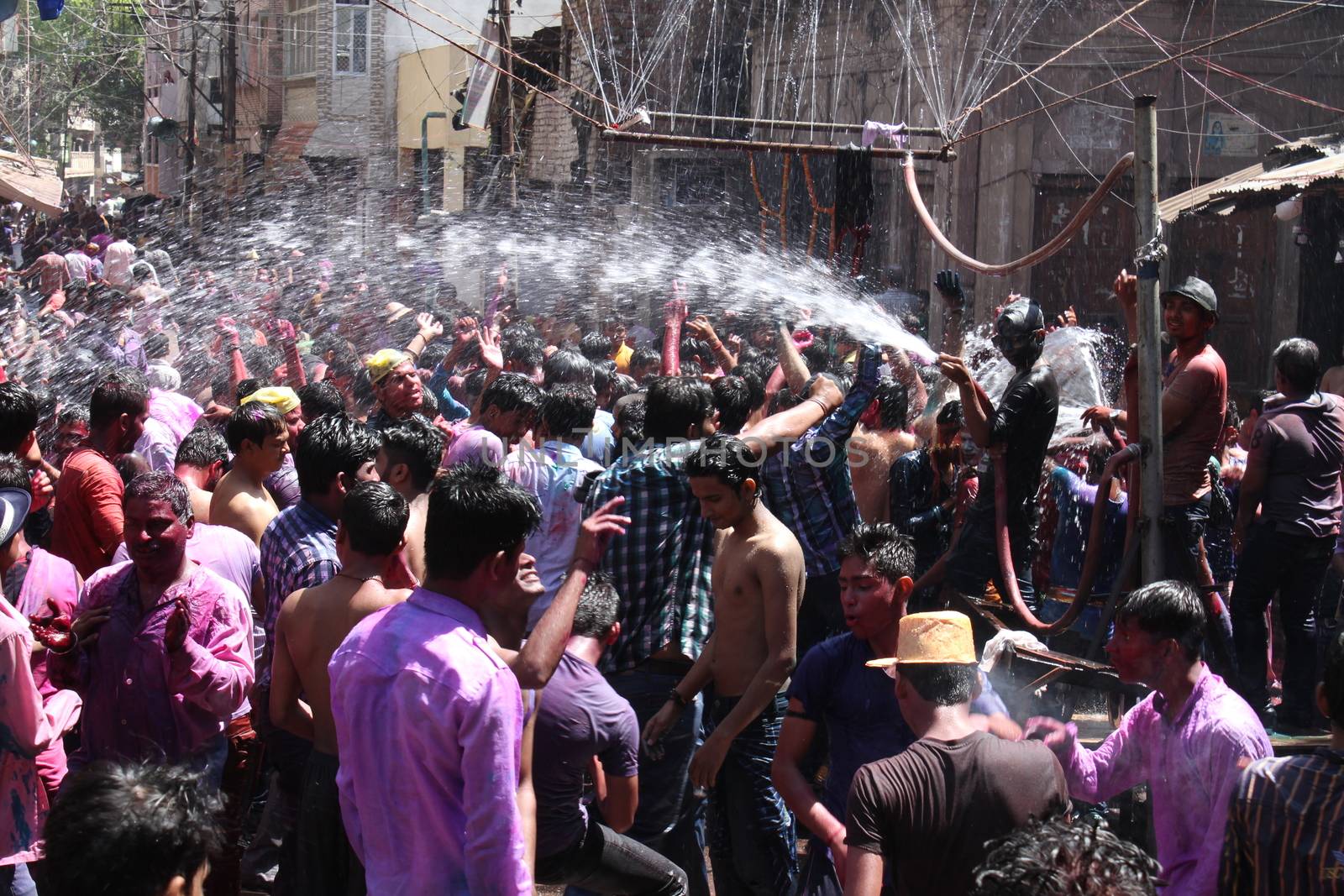 INDIA, Allahabad :  Indian people celebrate the Holi festival in Allahabad on March 23, 2015. Holi, the Hindu spring festival or 'Festival of Colours' is celebrated with coloured powder and water and marks the end of winter and the beginning of spring. 