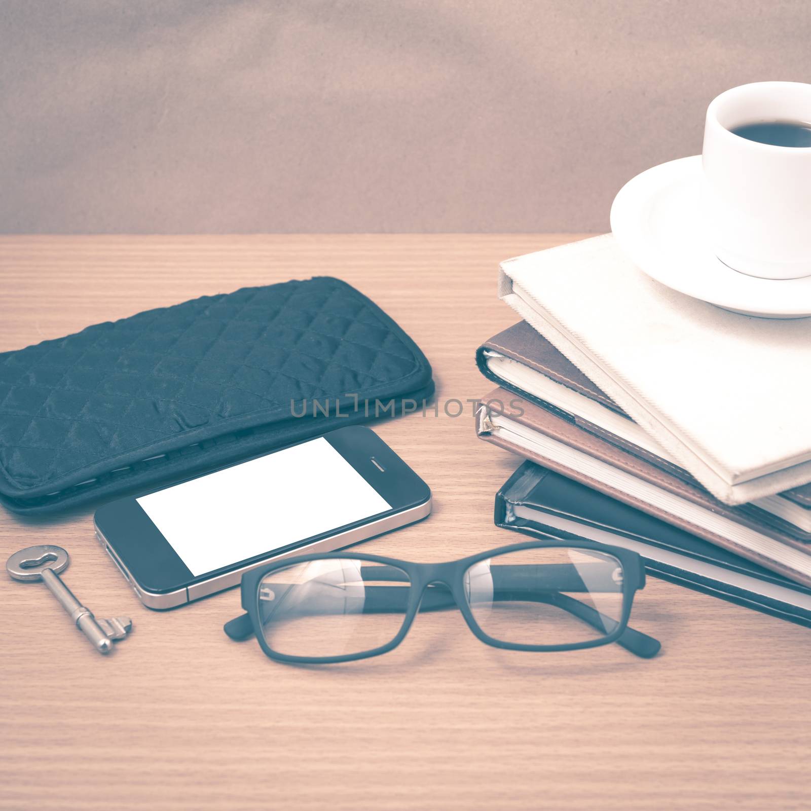 coffee and phone with stack of book,key,eyeglasses and wallet vi by ammza12