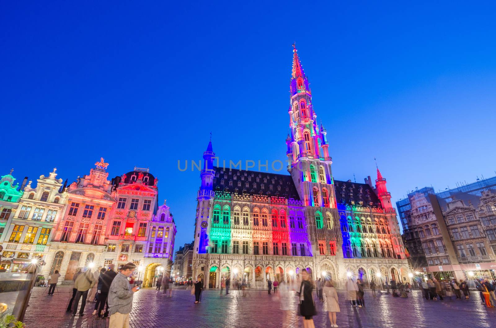 Brussels, Belgium - May 13, 2015: Tourists visiting famous Grand Place (Grote Markt) the central square of Brussels. The square is the most important tourist destination and most memorable landmark in Brussels. 