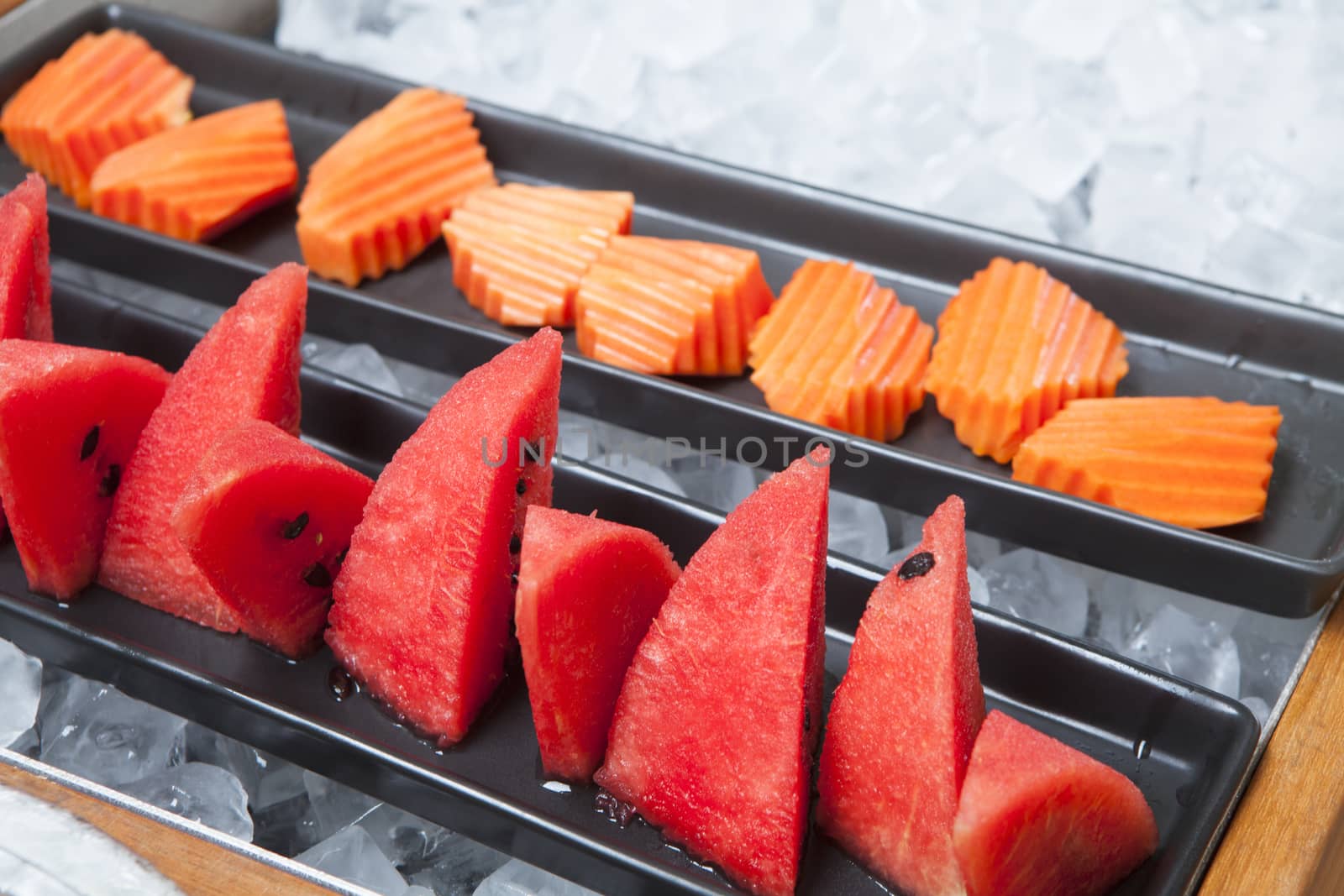 Watermelon, papaya and put on a container ready for breakfast.