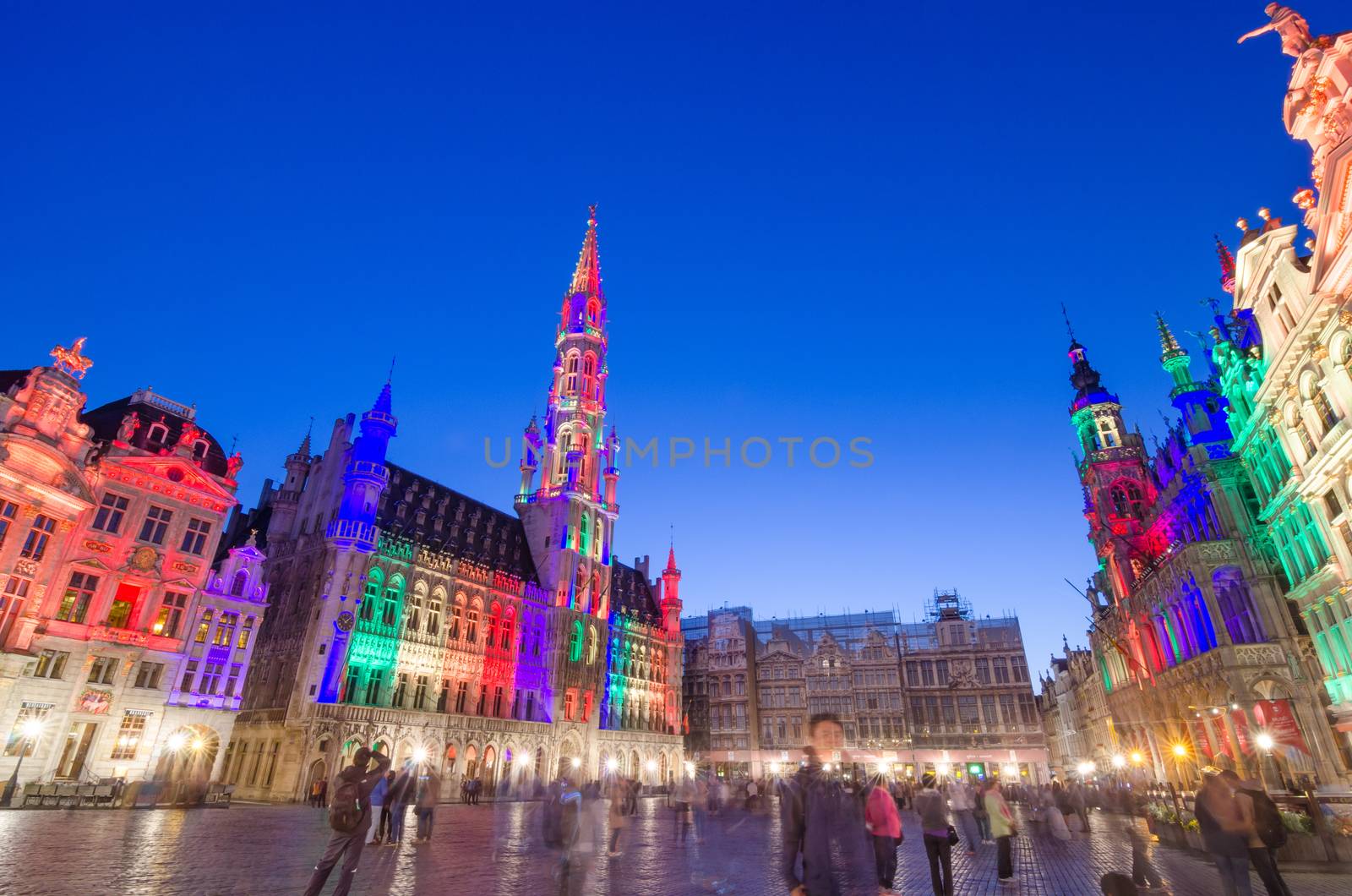 Brussels, Belgium - May 13, 2015: Tourists visiting famous Grand Place (Grote Markt) the central square of Brussels. by siraanamwong