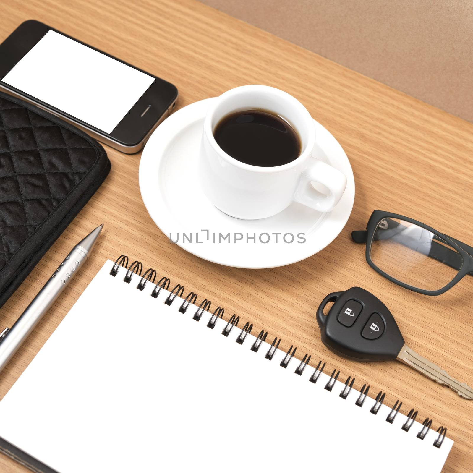 coffee and phone with notepad,car key,eyeglasses and wallet on wood table background