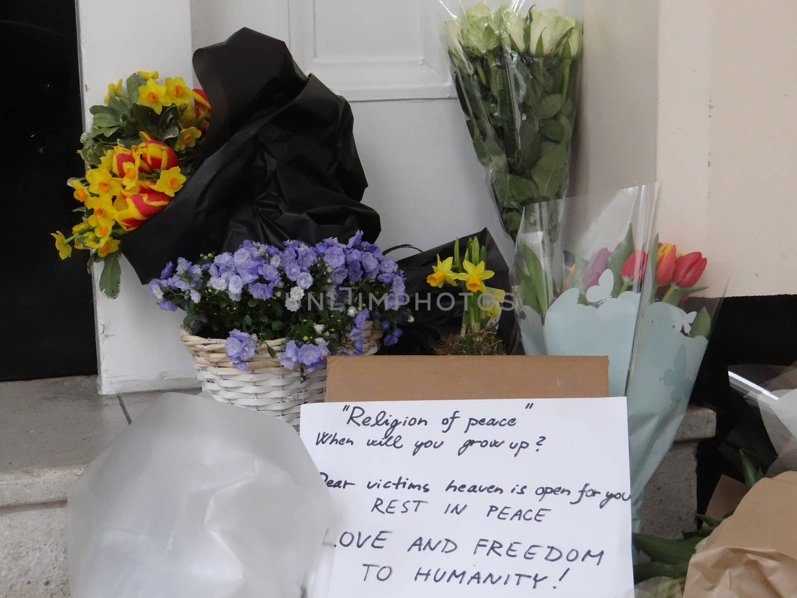 UNITED KINGDOM, London : Tributes to the victims of the terror attacks in Brussels are seen inside the Belgian Embassy in central London on March 23, 2016.Security was tightened across Europe and transport links paralysed after a series of apparently coordinated explosions ripped through Brussels airport and a metro train, killing at least 35 people.