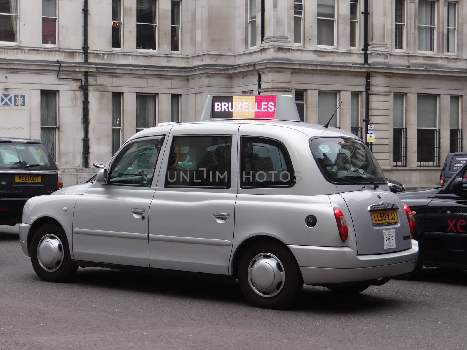 UNITED KINGDOM, London : Tributes to the victims of the terror attacks in Brussels are seen on taxi cabs in central London on March 23, 2016.Security was tightened across Europe and transport links paralysed after a series of apparently coordinated explosions ripped through Brussels airport and a metro train, killing at least 35 people.