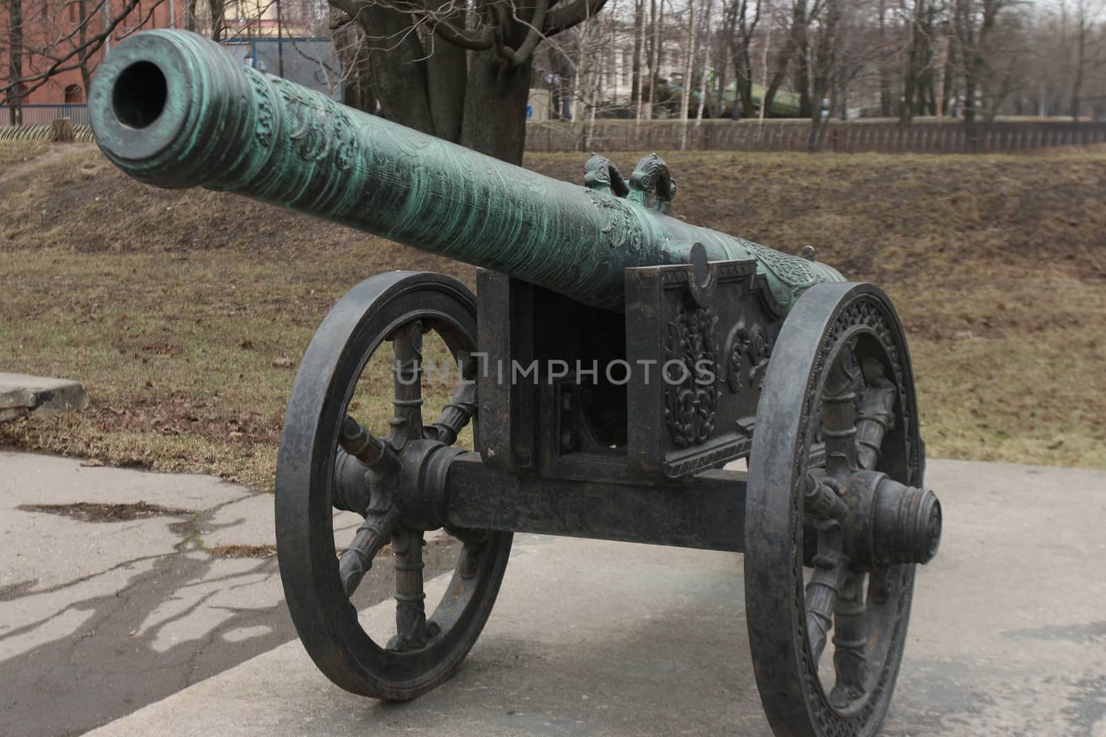 old medieval bronze cannon on the gun carriage front view