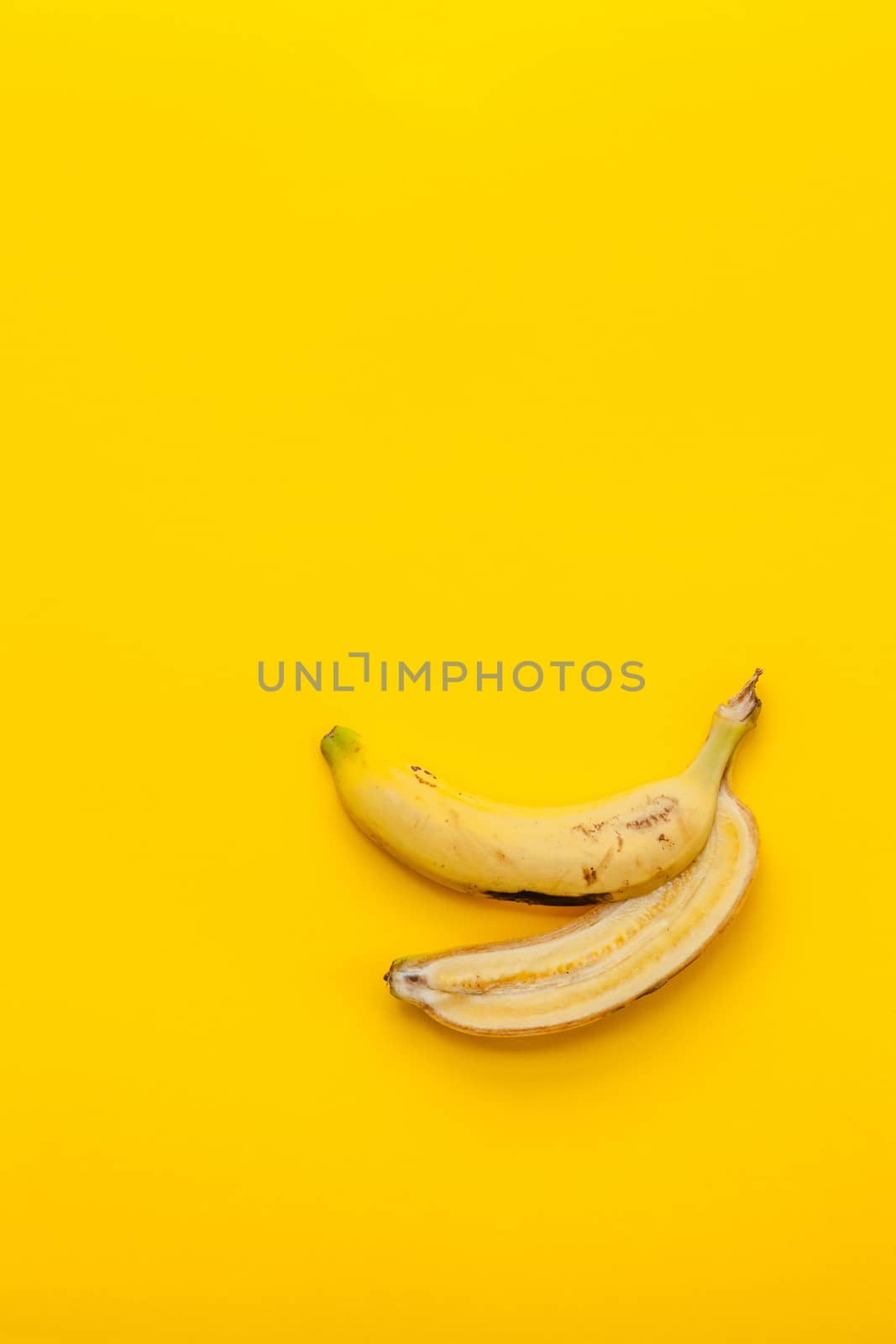 Peel banana and fruit on a yellow background and colorful background