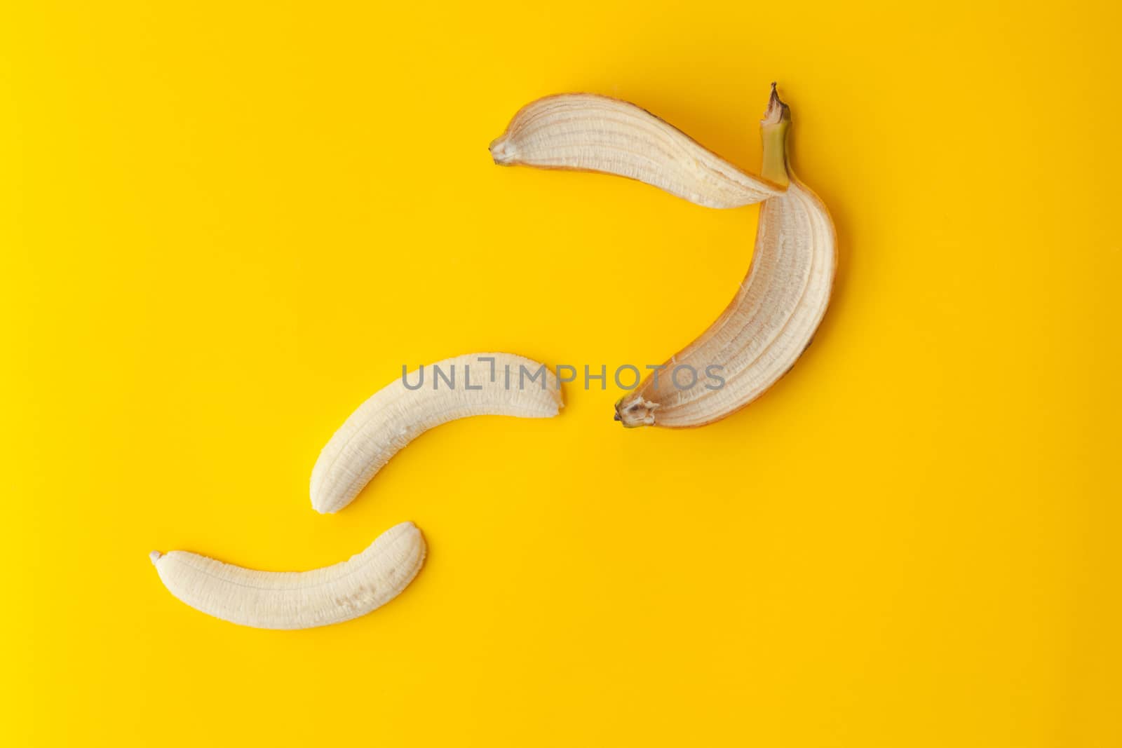 Peel banana and fruit on a yellow background and colorful background
